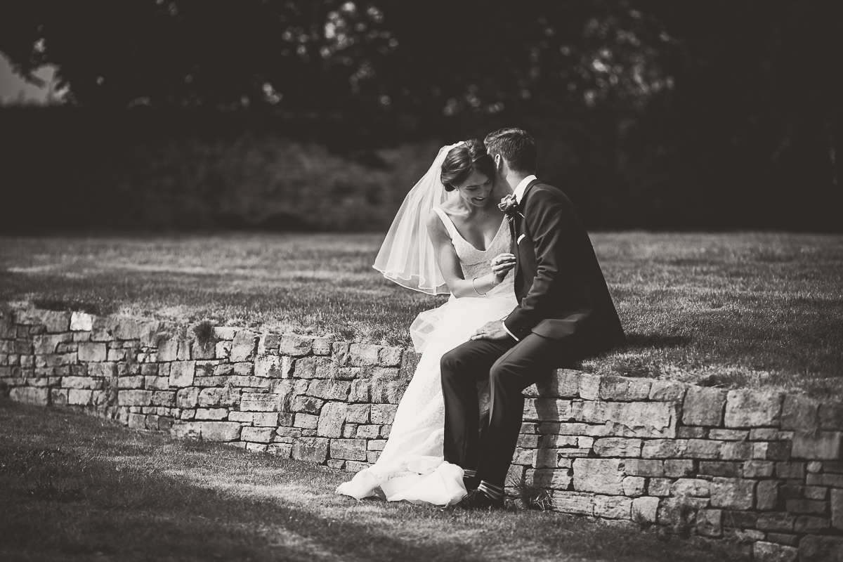 A bride and groom captured in romantic wedding photos by a skilled wedding photographer.