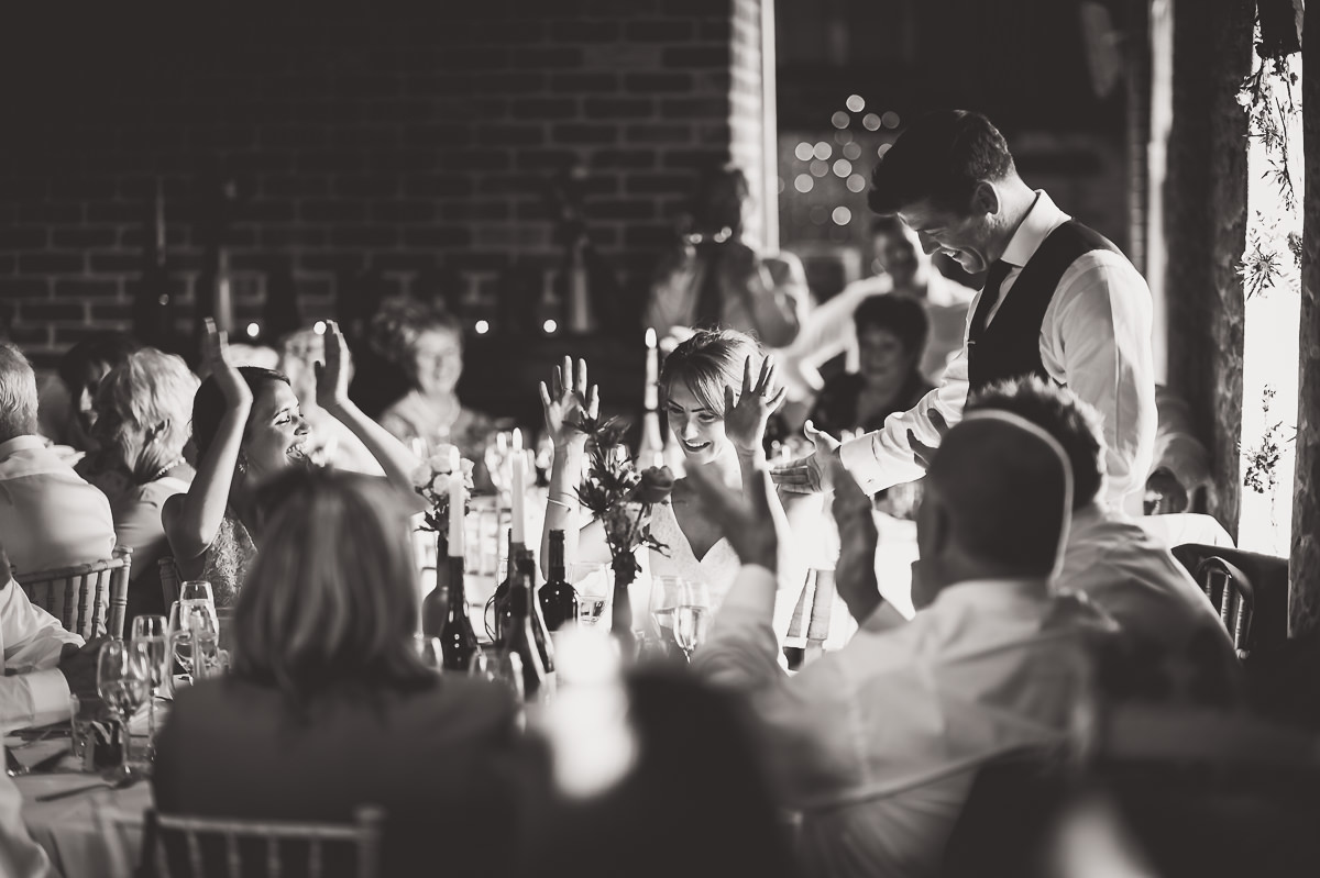 A black and white photo capturing the wedding reception, taken by a talented wedding photographer.