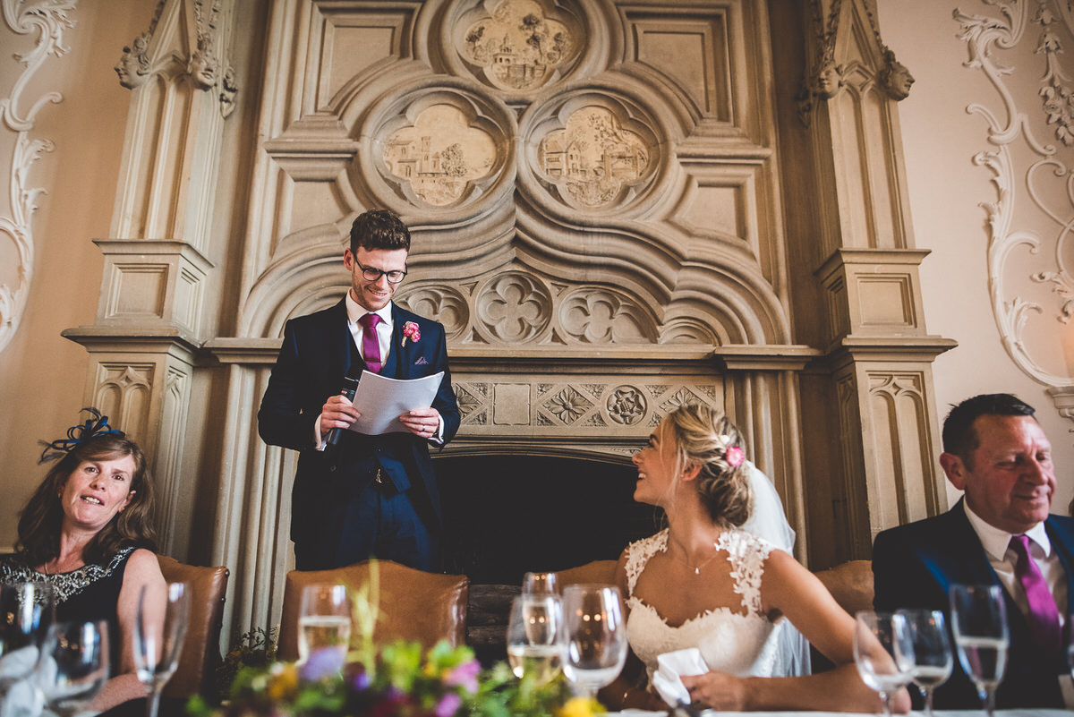 The groom delivers a heartfelt speech at his wedding reception.