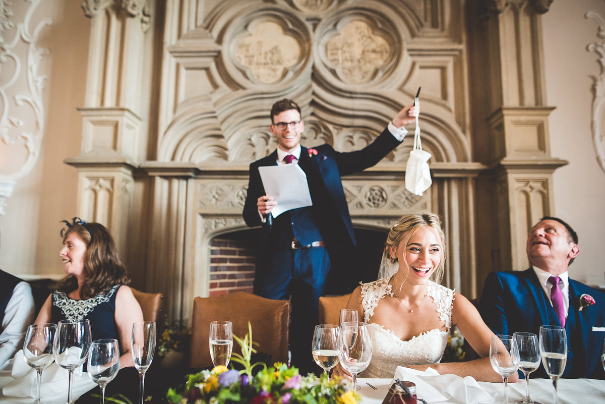 A couple raising a wedding toast in a delightful wedding photo.
