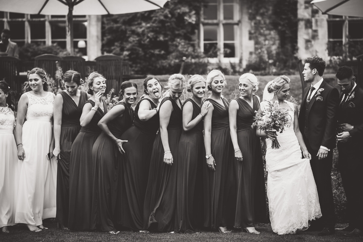 A wedding photo capturing a group of bridesmaids and groomsmen.