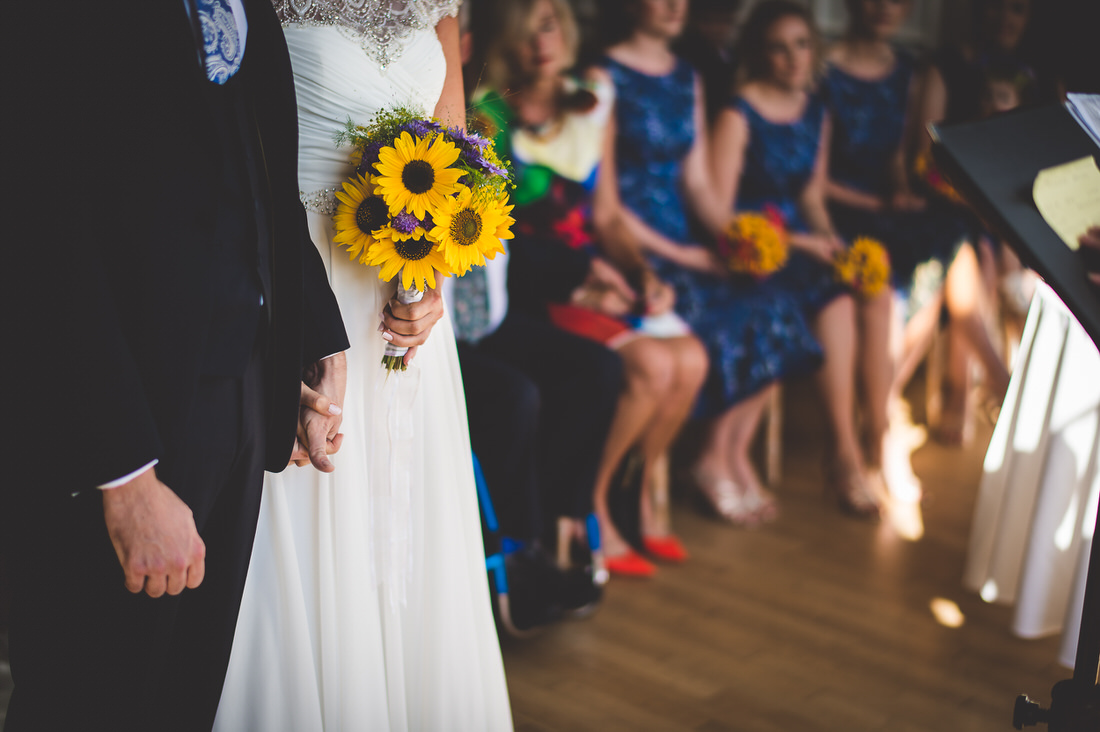 A bride and groom captured by a wedding photographer during their wedding ceremony.