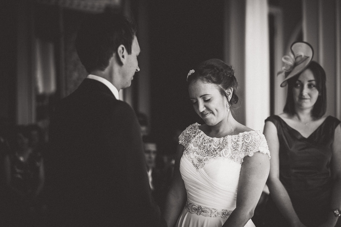 A wedding photo captures the bride and groom sharing a heartfelt gaze.