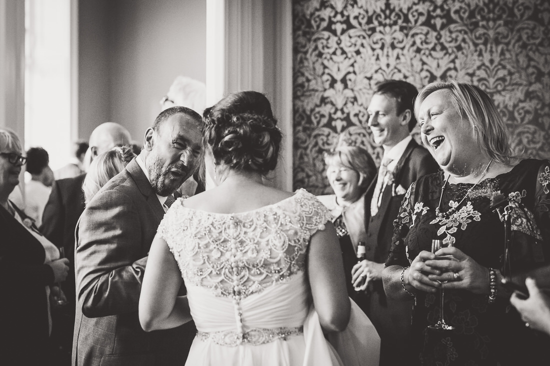 A black and white photograph capturing a wedding couple - the bride and groom.
