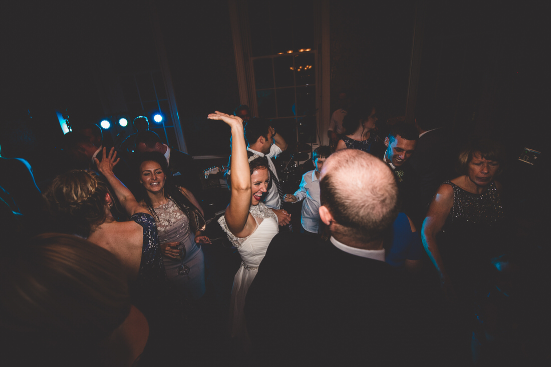 A groom and bride captured by a wedding photographer in a memorable wedding photo on the dance floor.