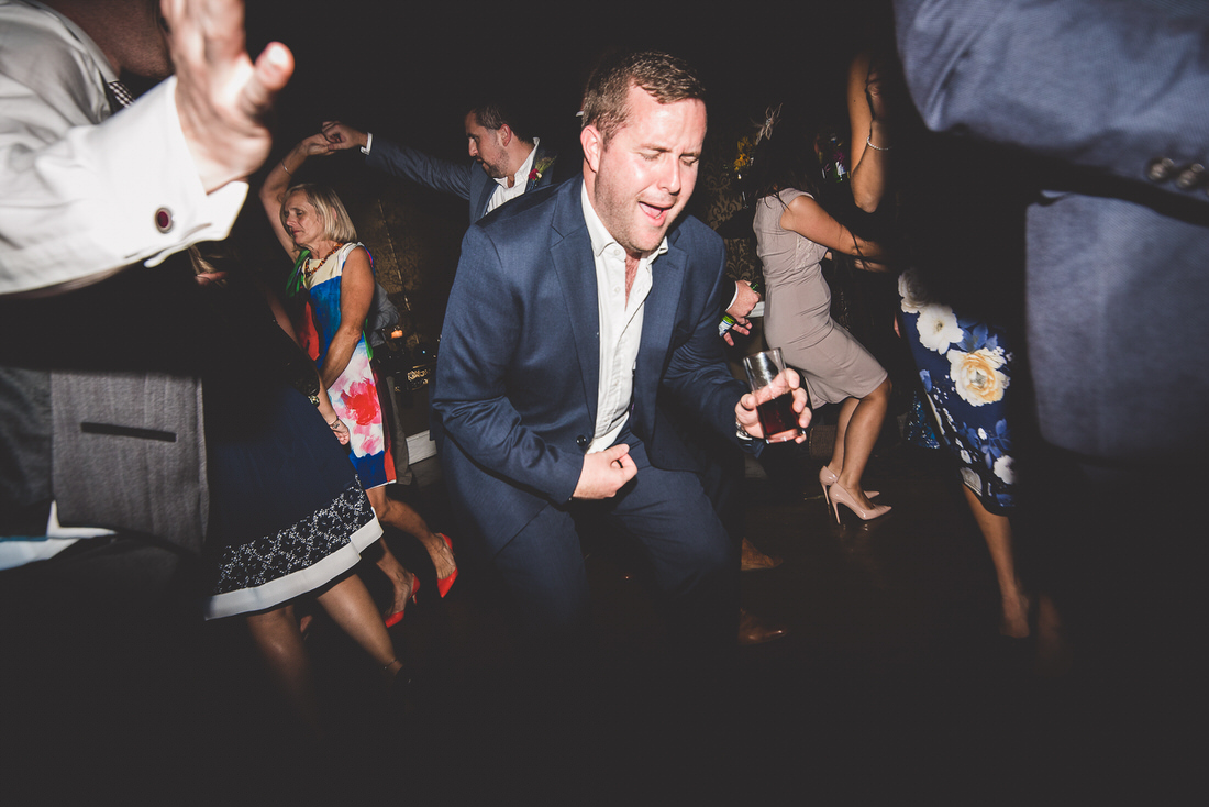 A groom dancing on the wedding dance floor.