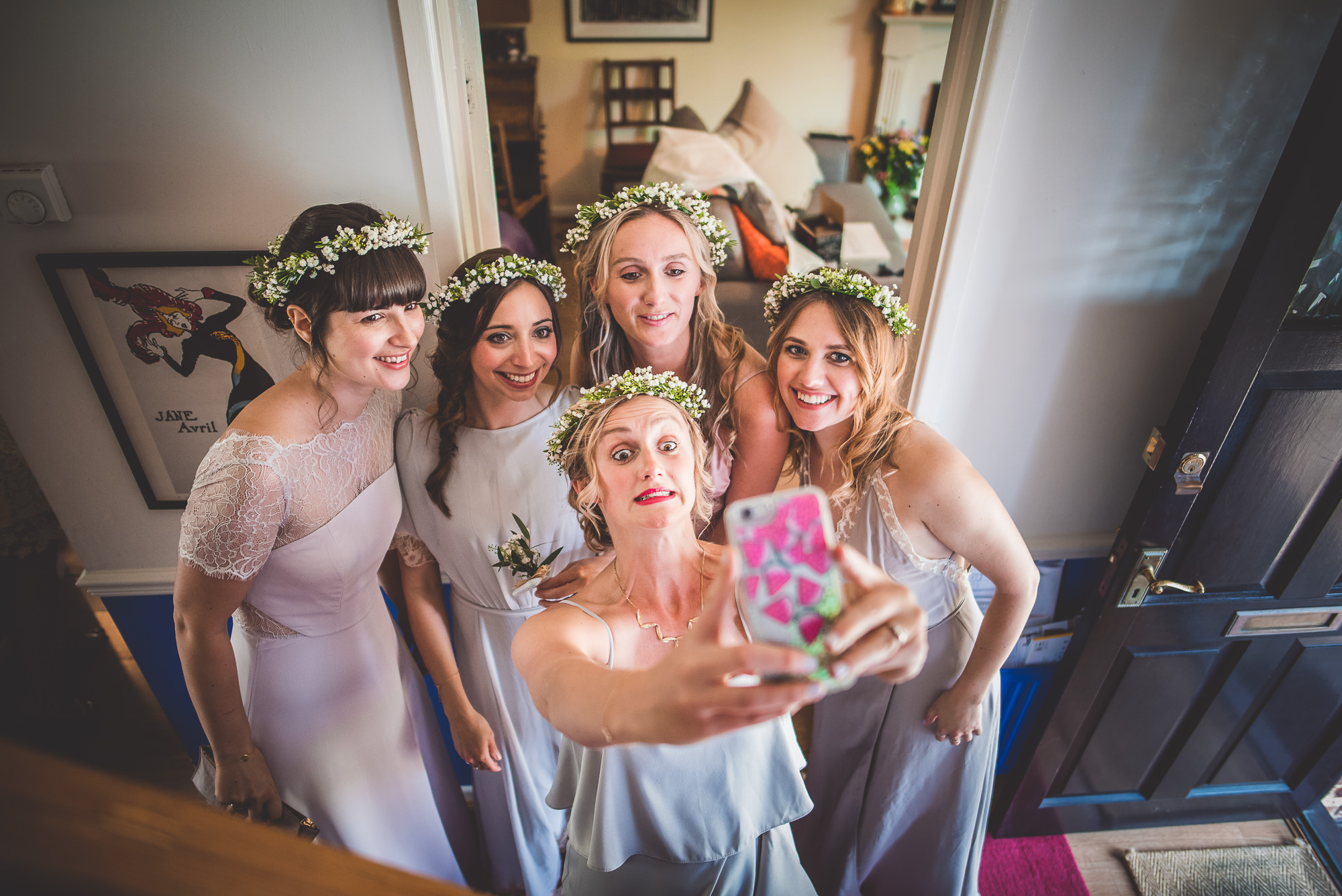 Bridesmaids capturing a selfie during the wedding.