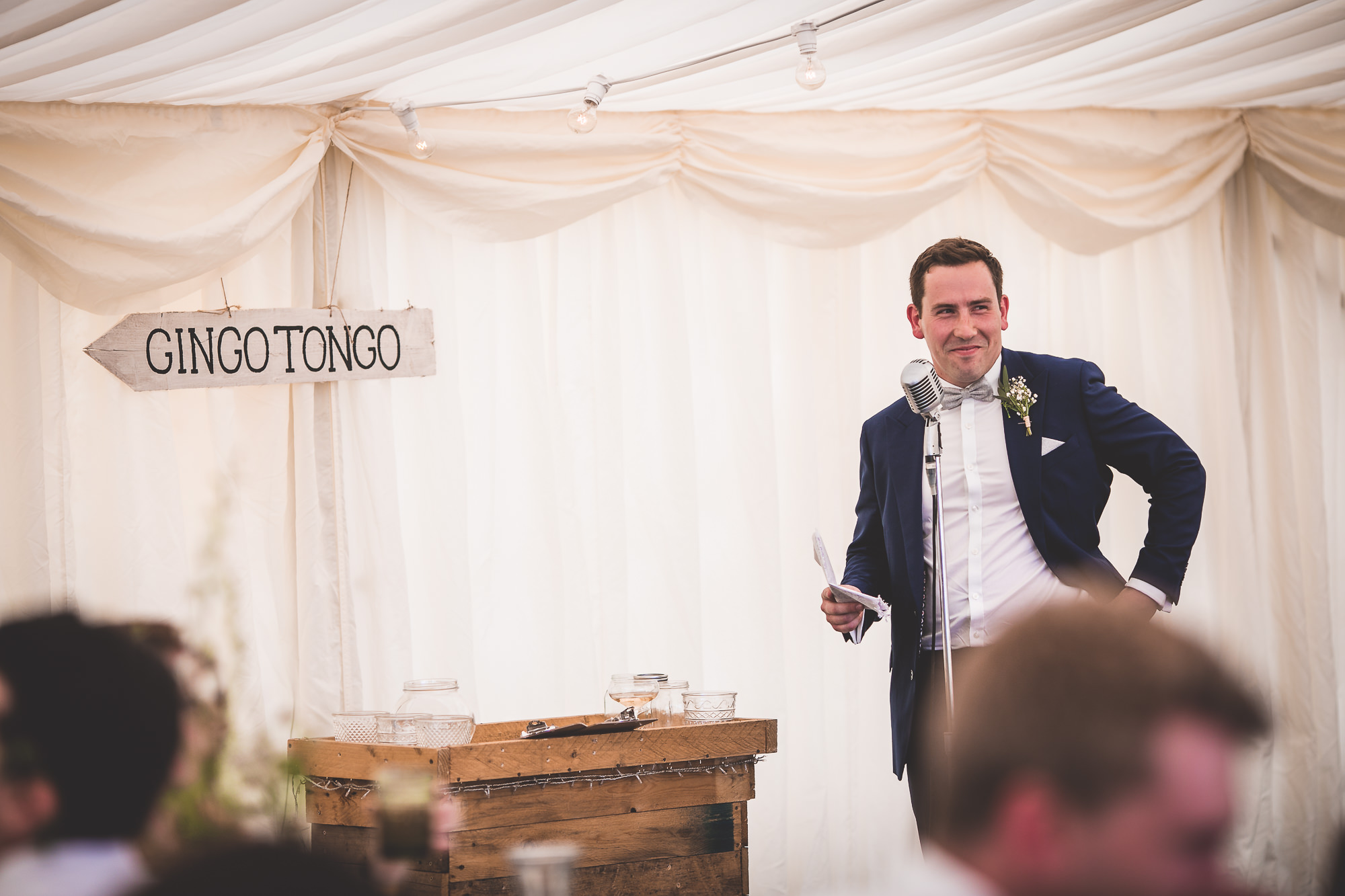 A groom giving a speech at his wedding.