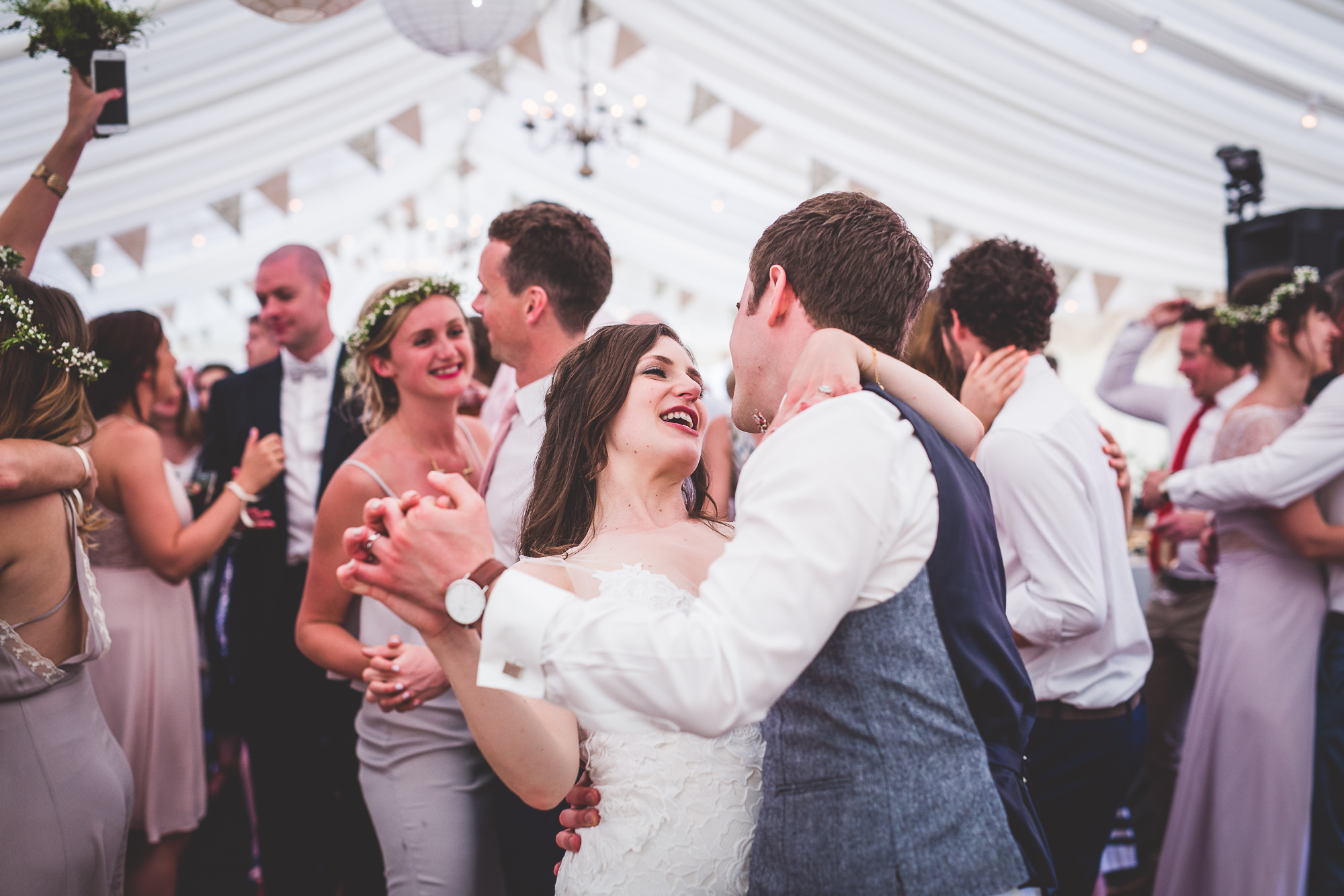 A bride and groom dancing at their wedding.