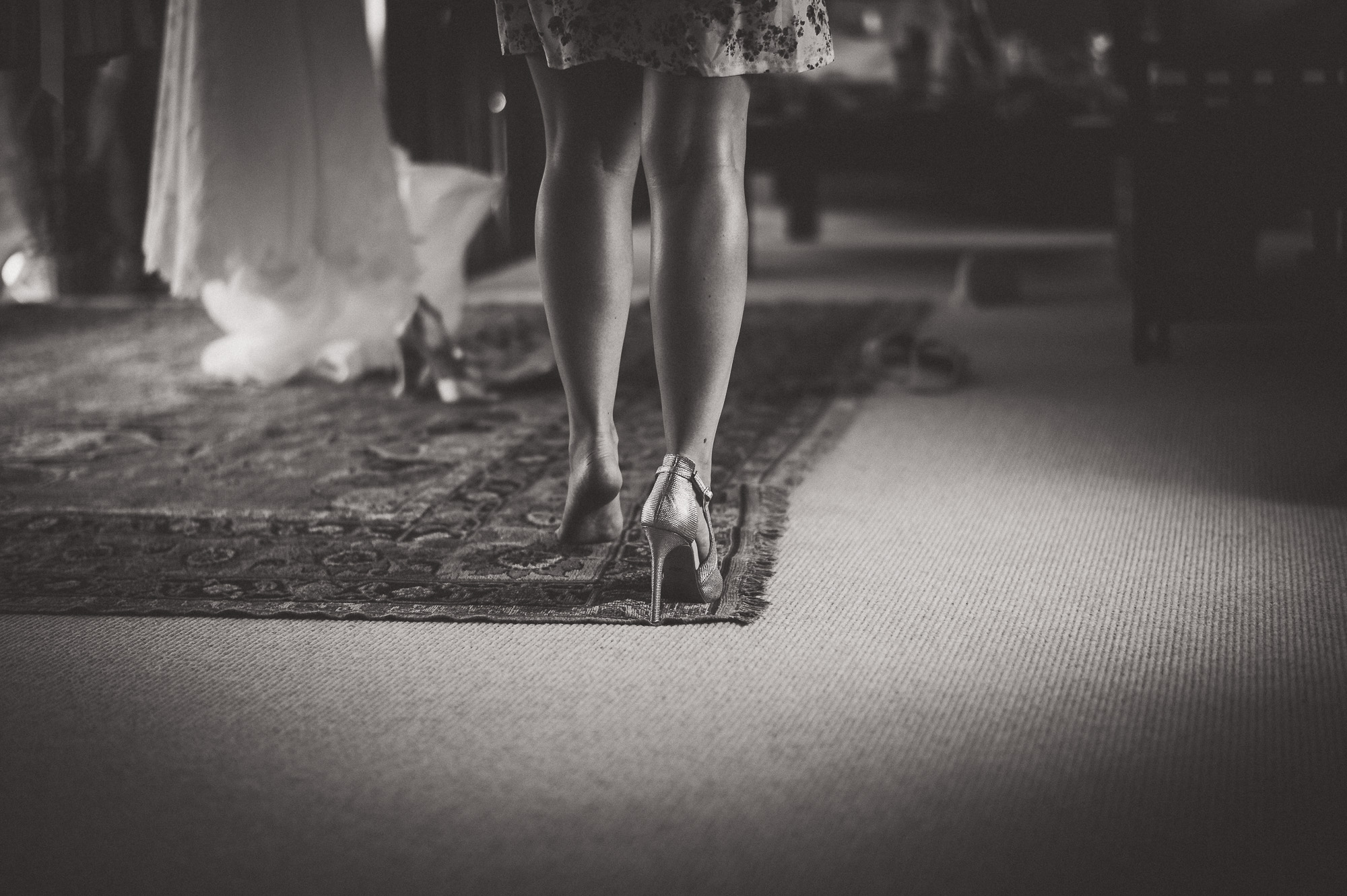 A black and white wedding photo featuring a bride with a dress.