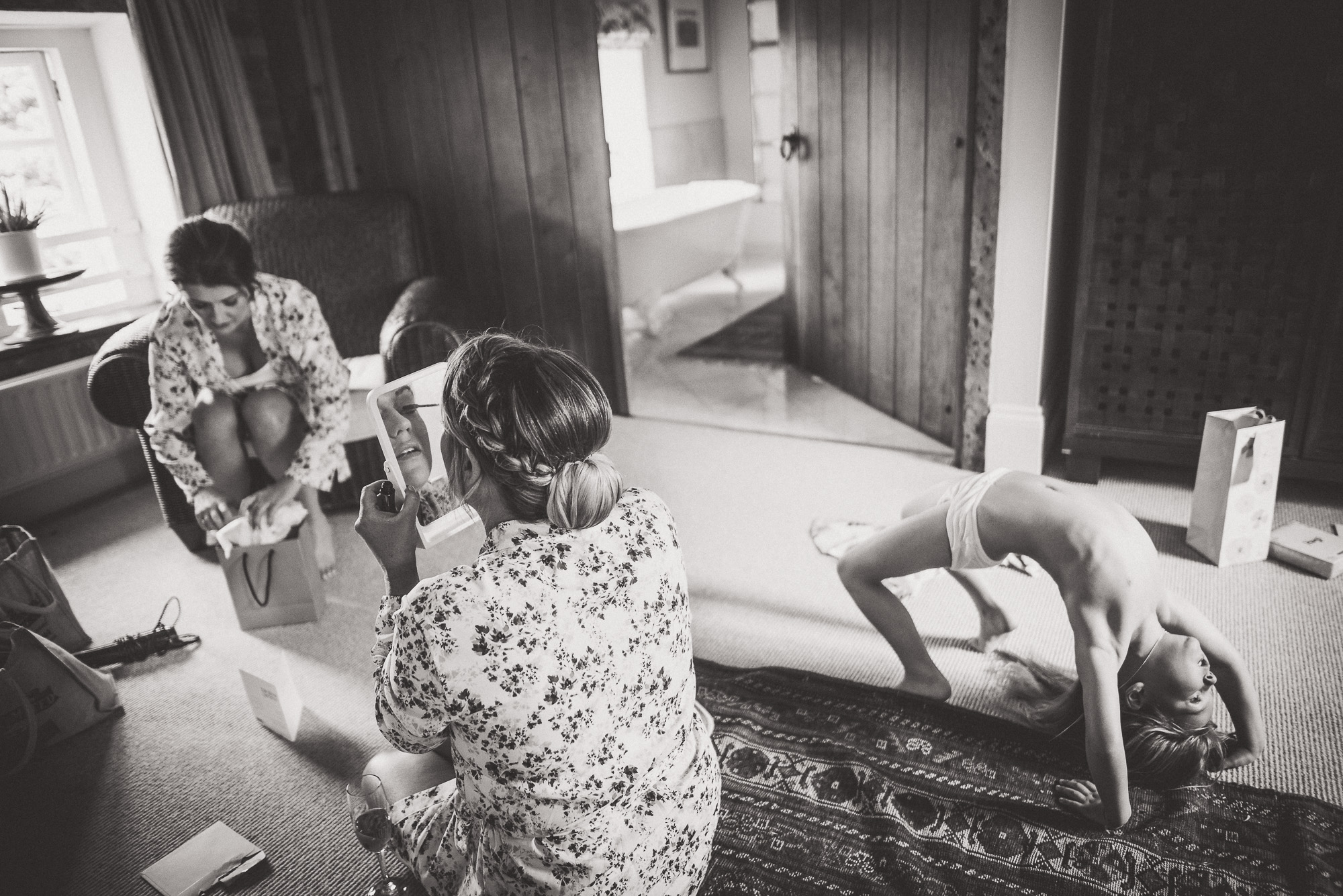 A wedding couple preparing in a room.