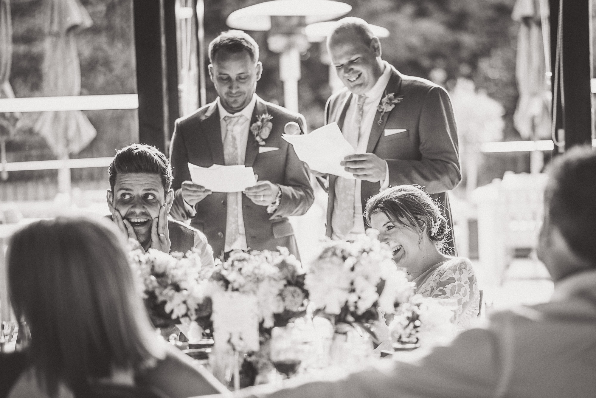 A wedding photo capturing a group of people, including the groom.