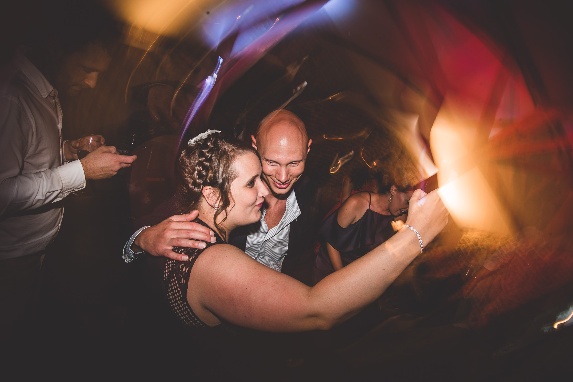 A bride and groom dancing at their wedding party.
