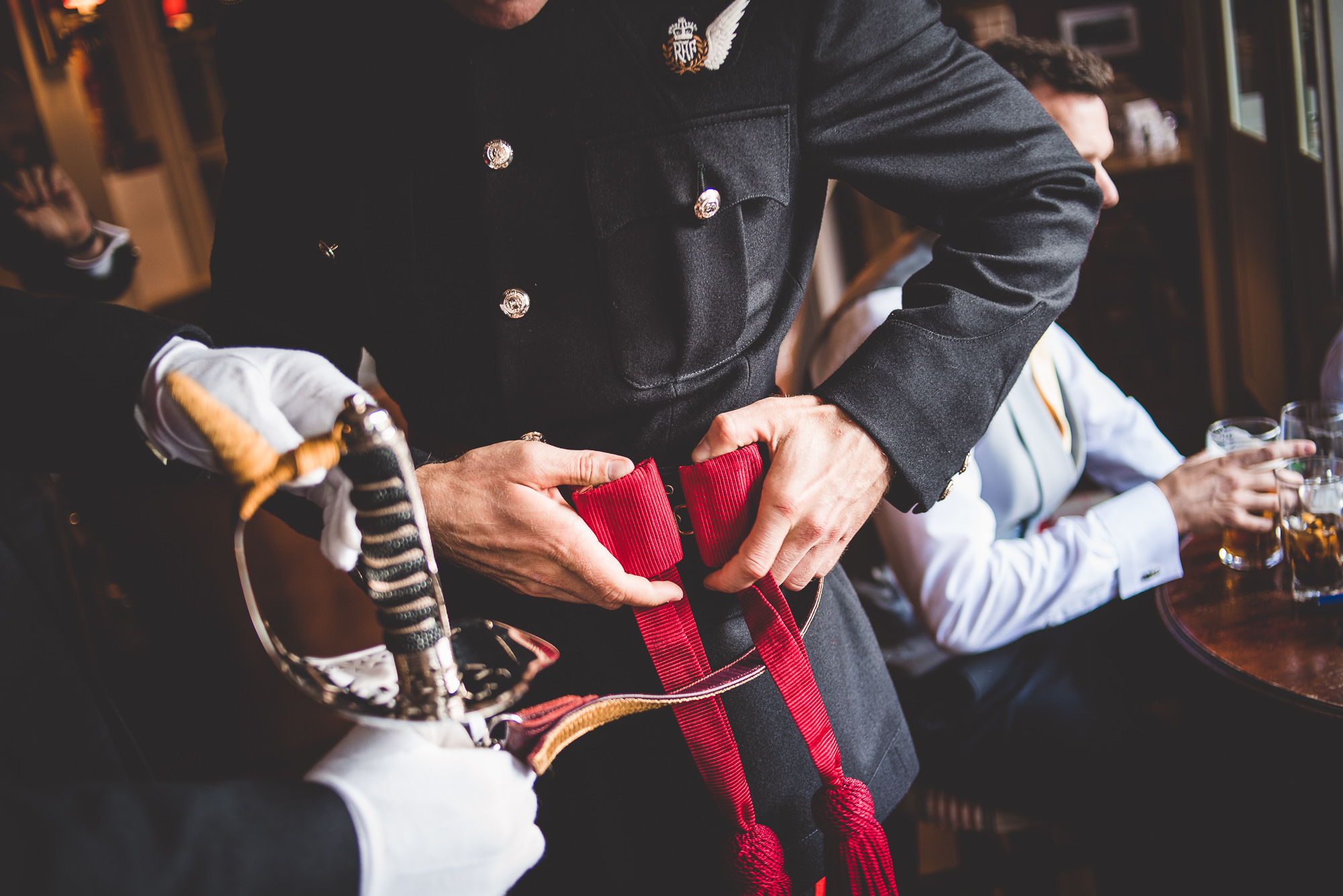 A groom wearing a uniform at his wedding.