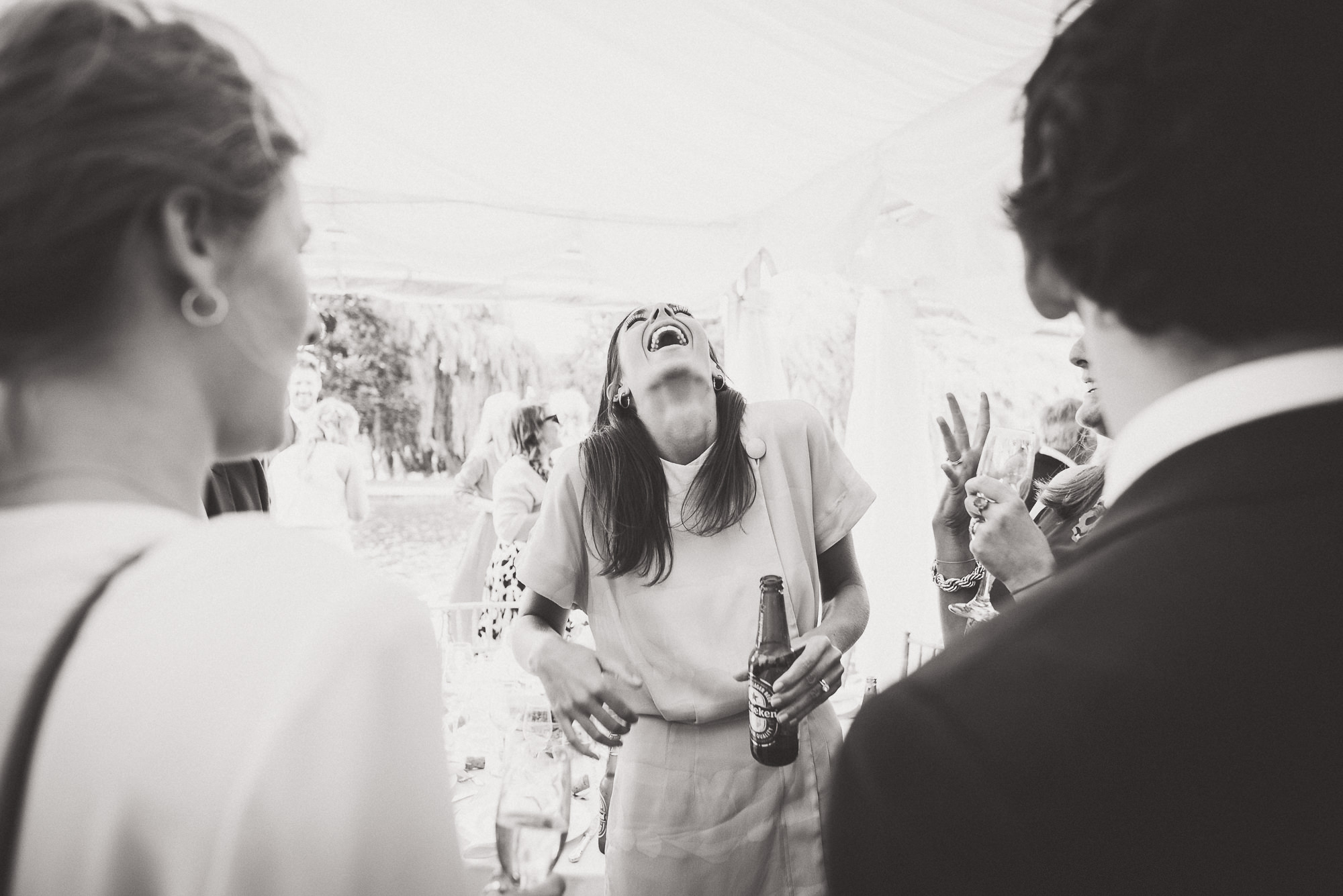 Black and white wedding photo capturing a group of people.