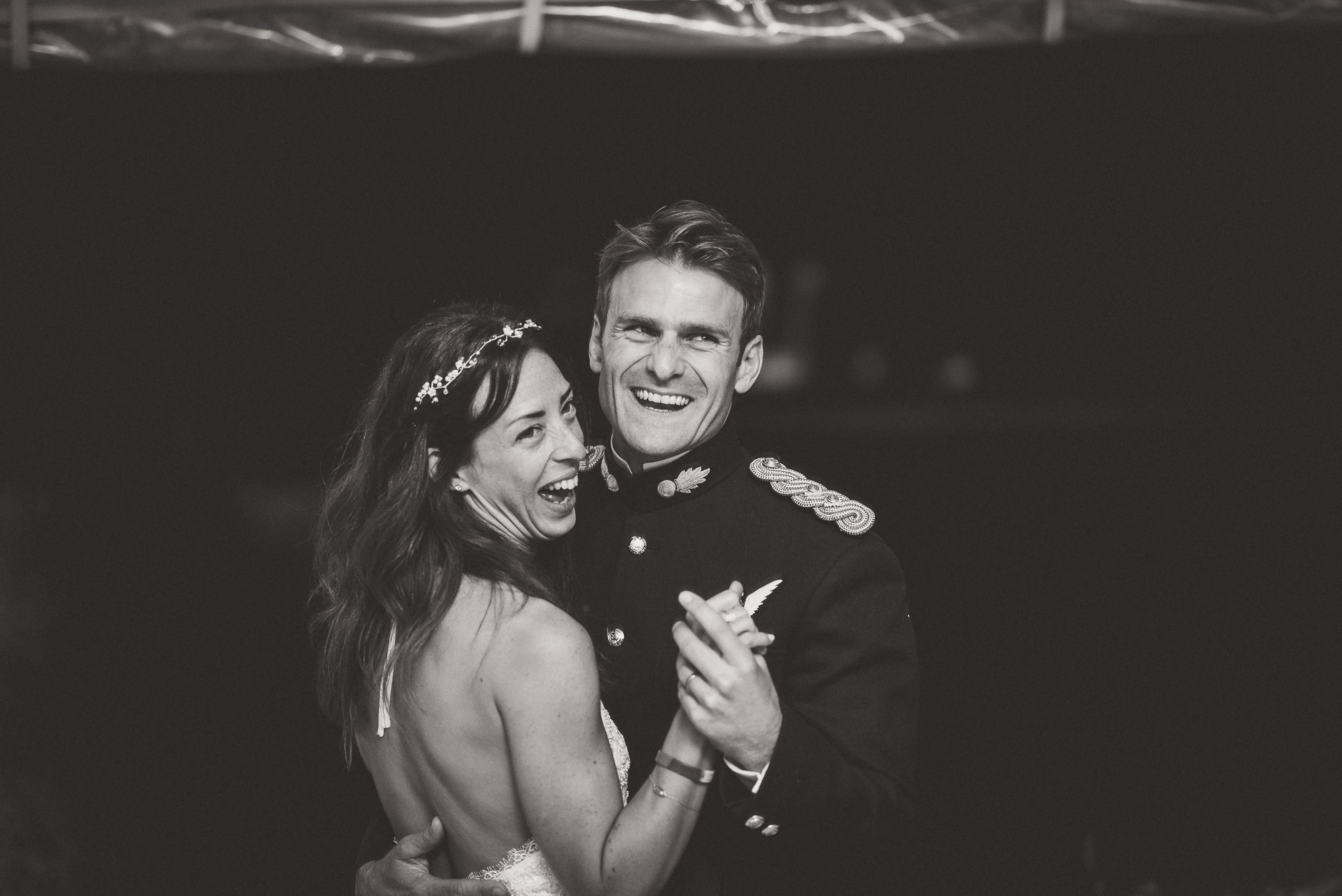 A bridal couple dancing at their wedding.