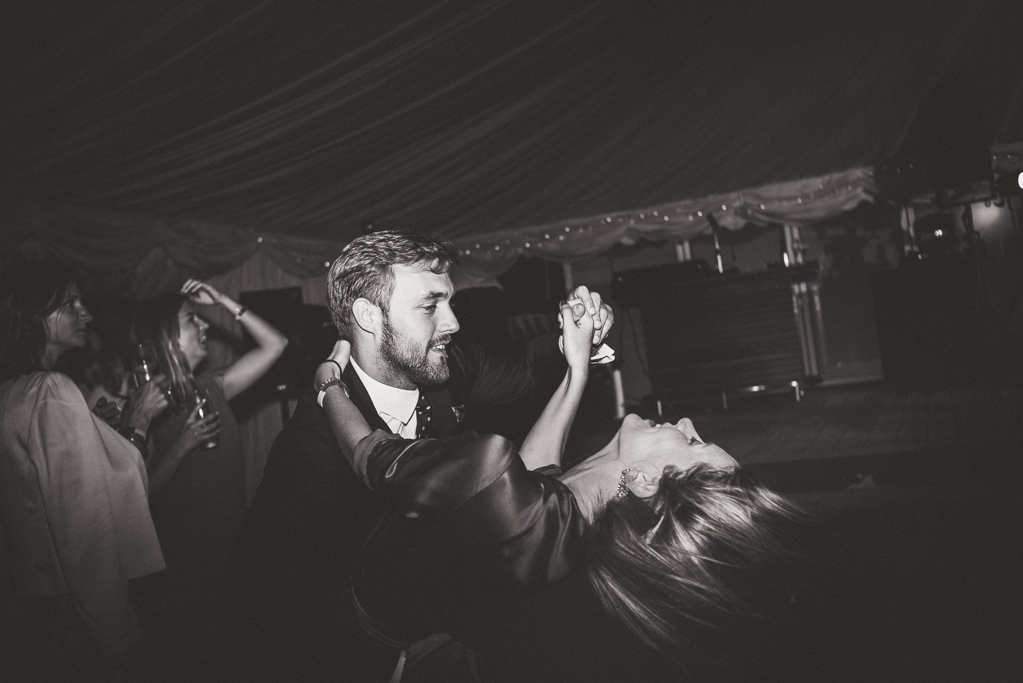 A bride and groom dancing at their wedding, captured in a heartfelt wedding photo.