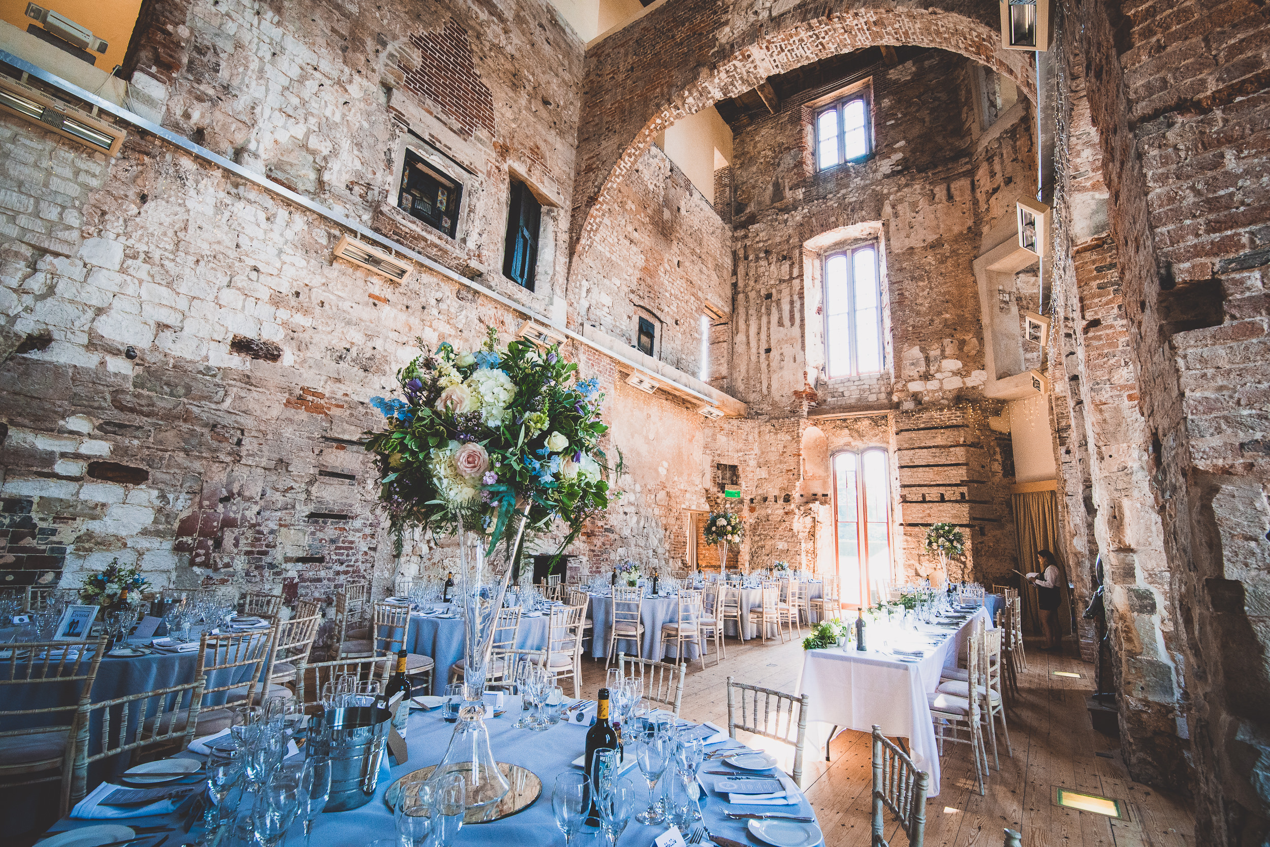 A bride and wedding photographer capture stunning wedding photos in an old castle.