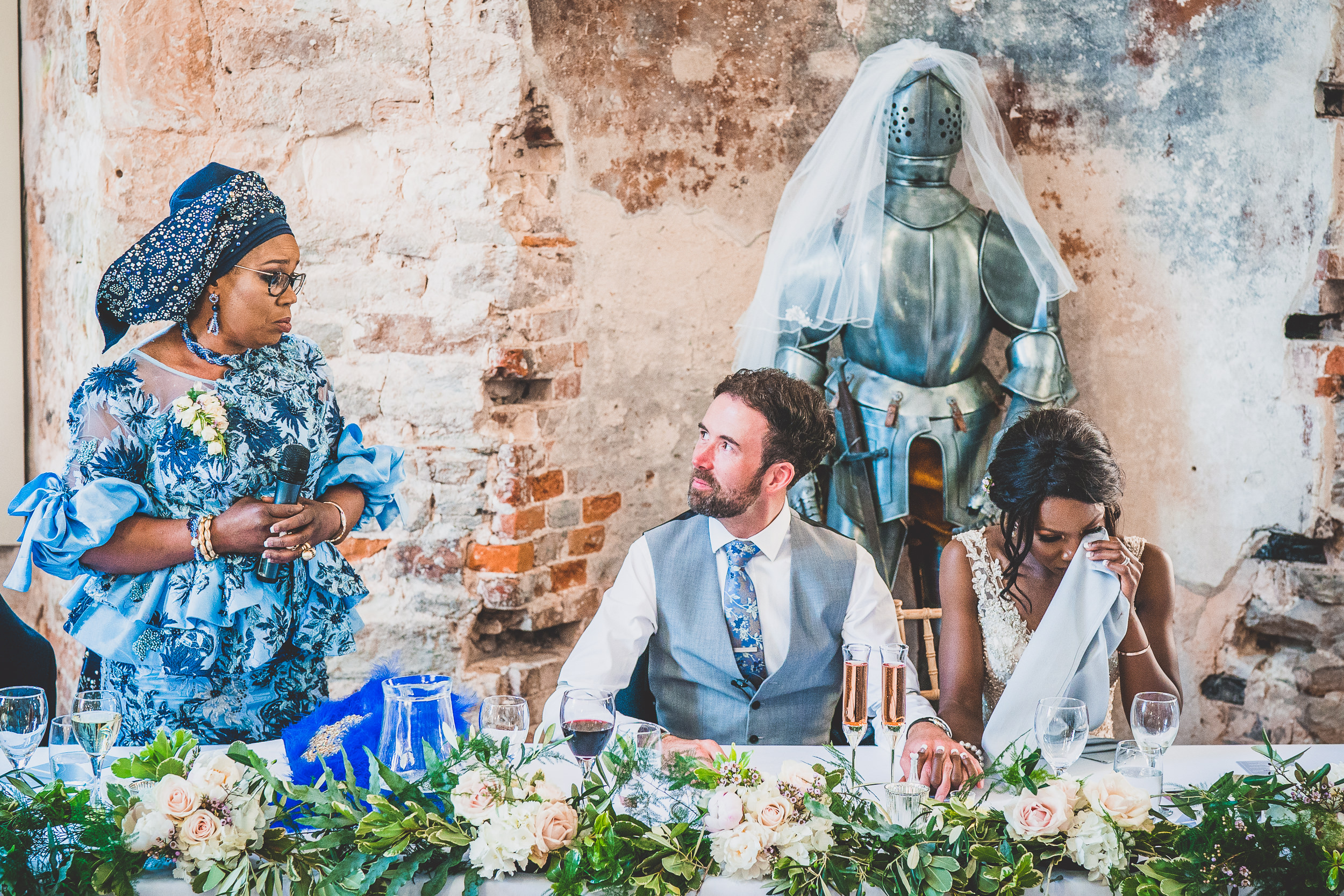 A wedding photographer captures a bride and groom at their dream castle wedding.