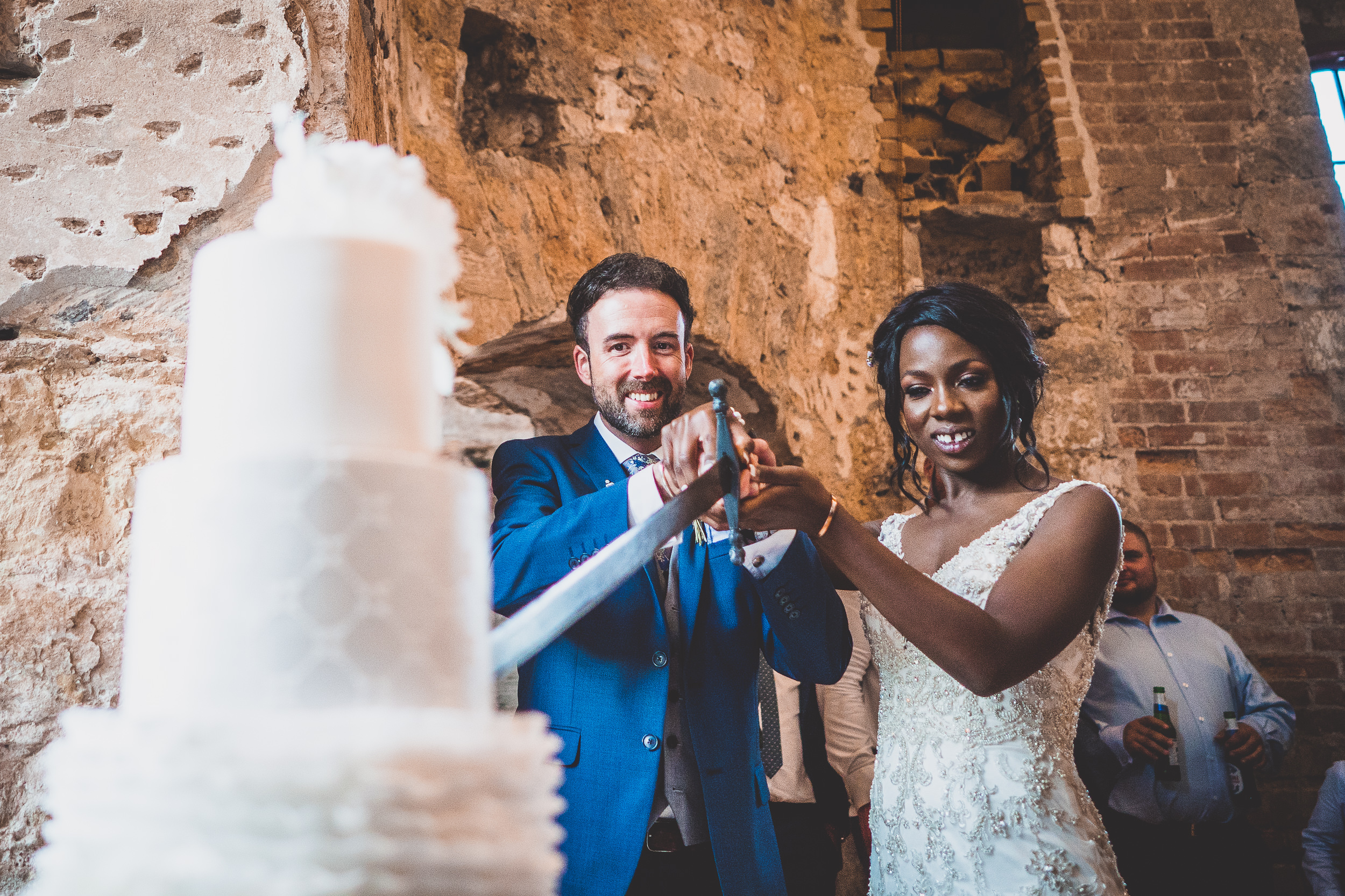 A wedding couple cutting their cake.