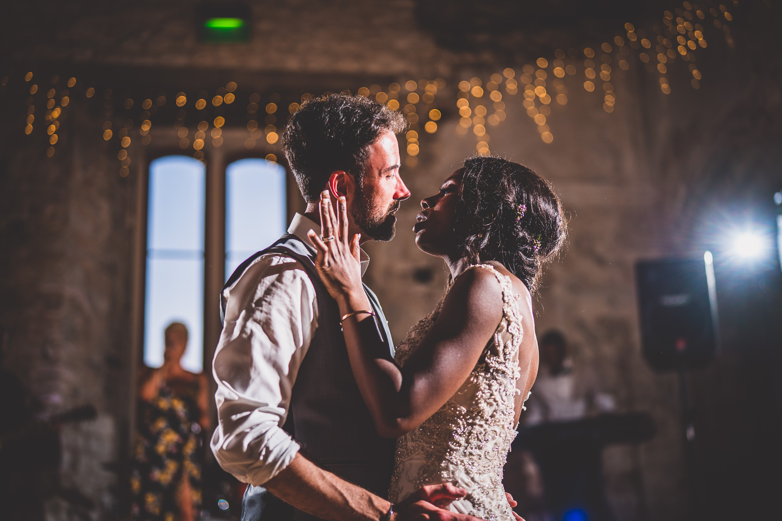 A wedding couple's first dance captured by a wedding photographer in a castle.