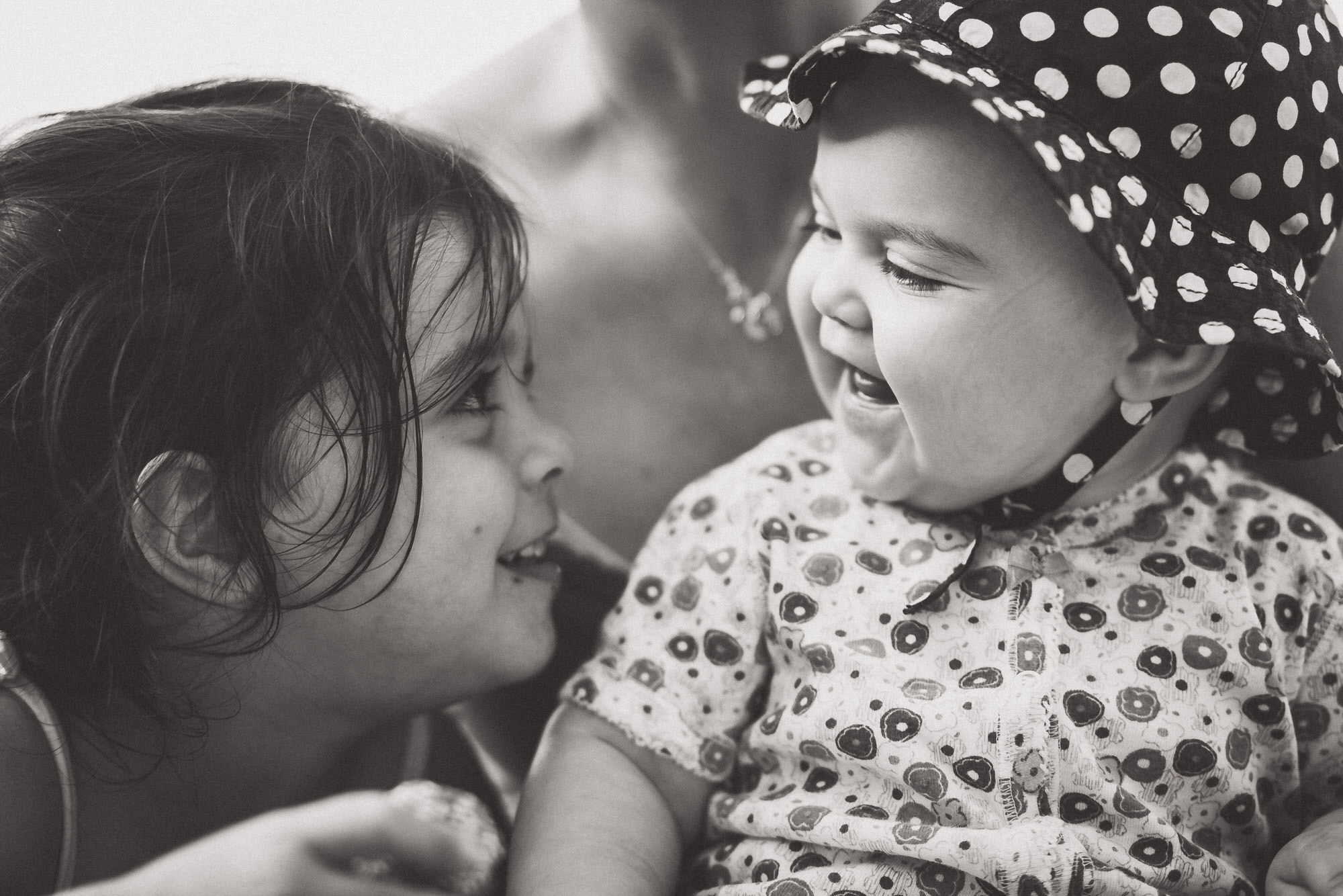 A black and white wedding photo of a mother and two small children.