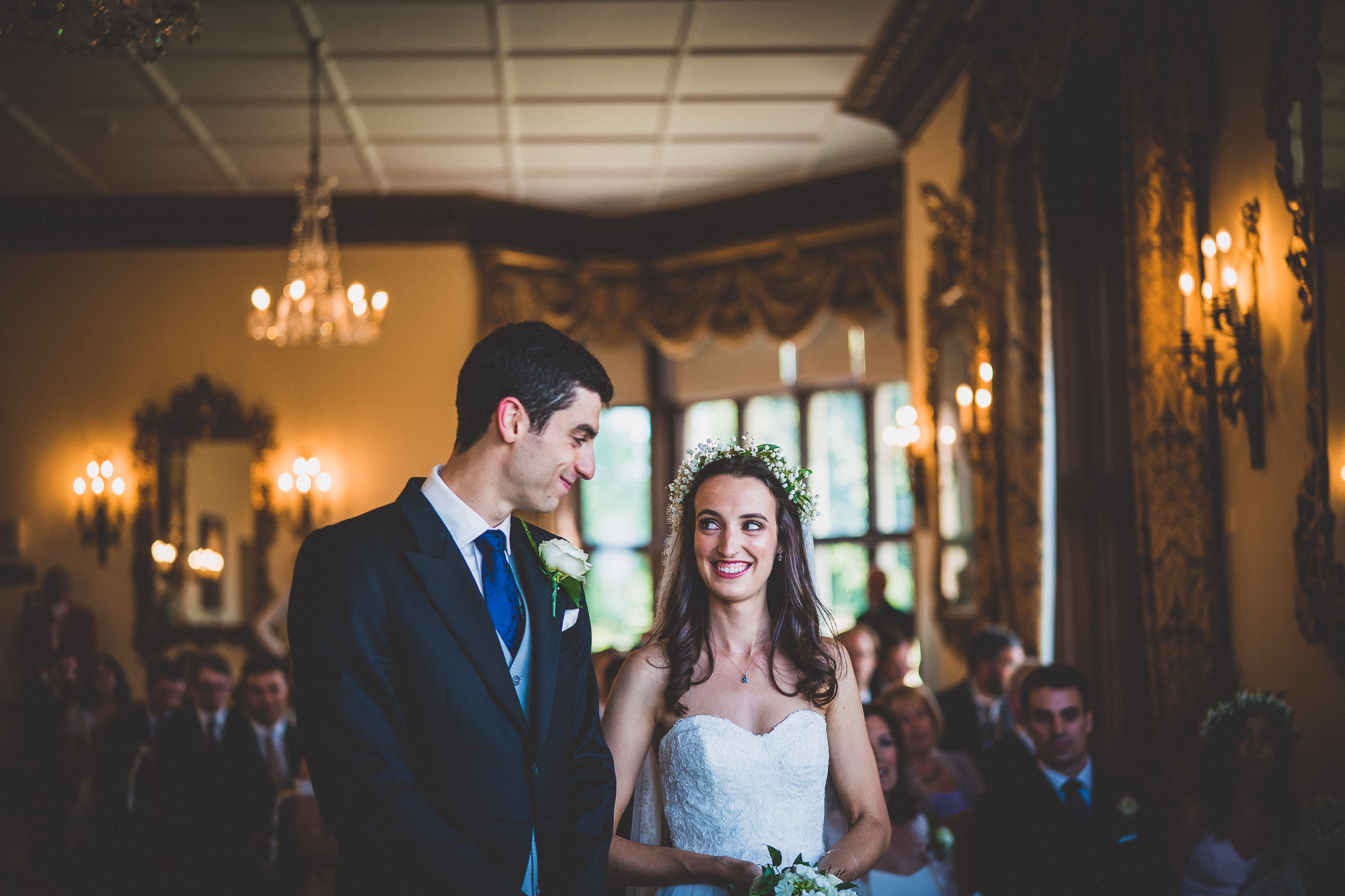 A groom and bride sharing an intimate moment captured by a wedding photographer.