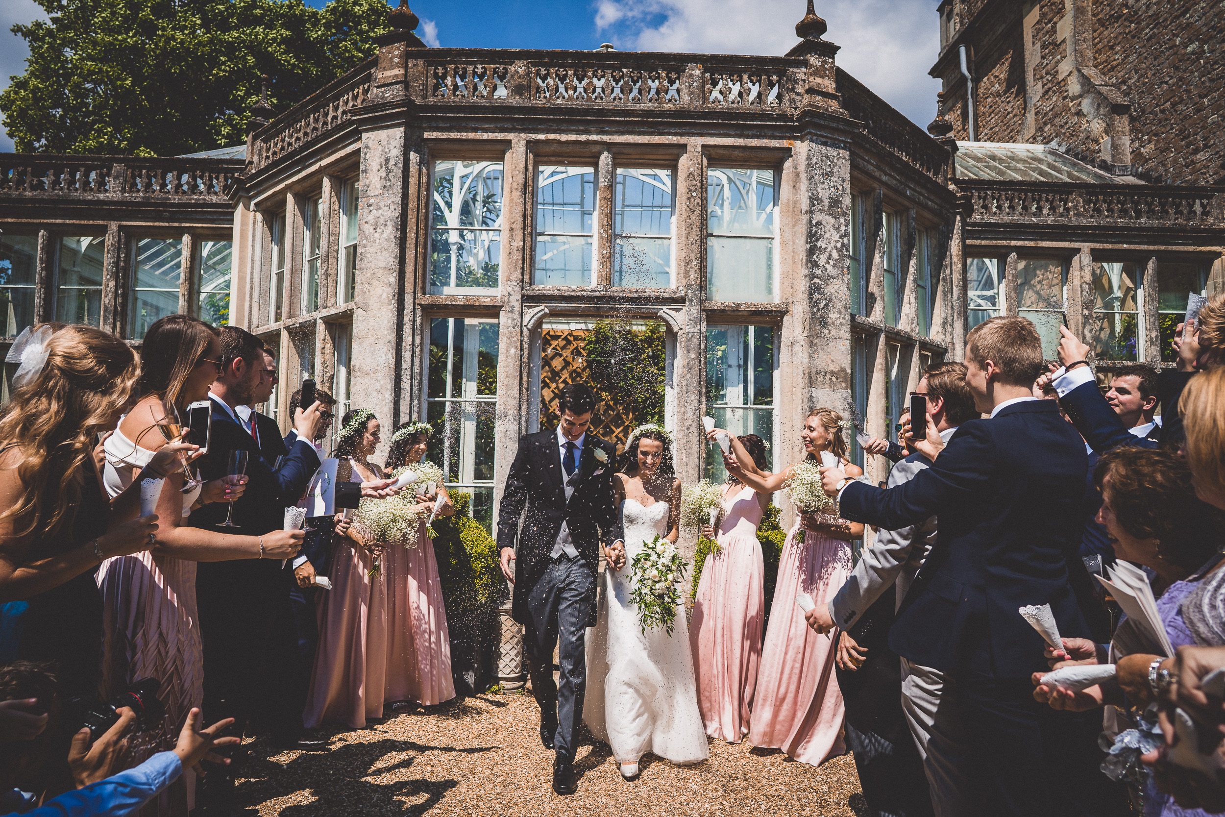 A glass house wedding captured by a talented wedding photographer.