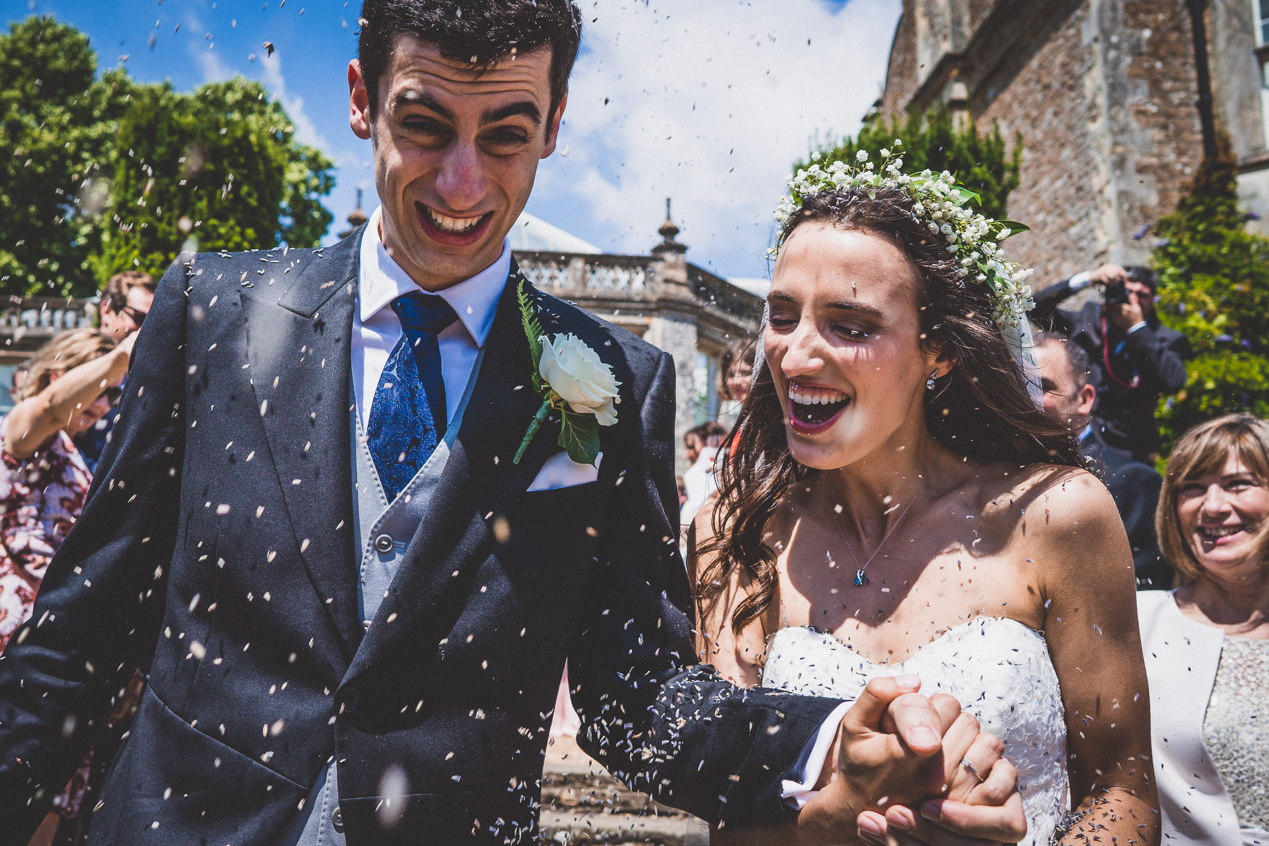 A wedding couple joyfully celebrate their special day, captured by the wedding photographer in a stunning wedding photo.