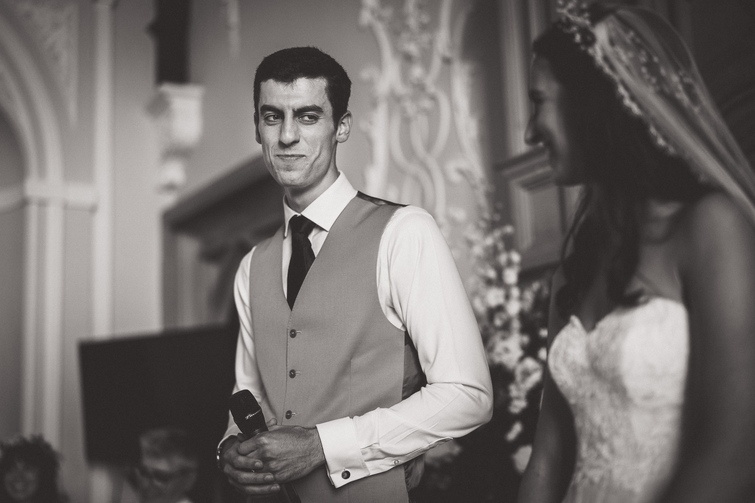 A groom and bride posing for a wedding photo.