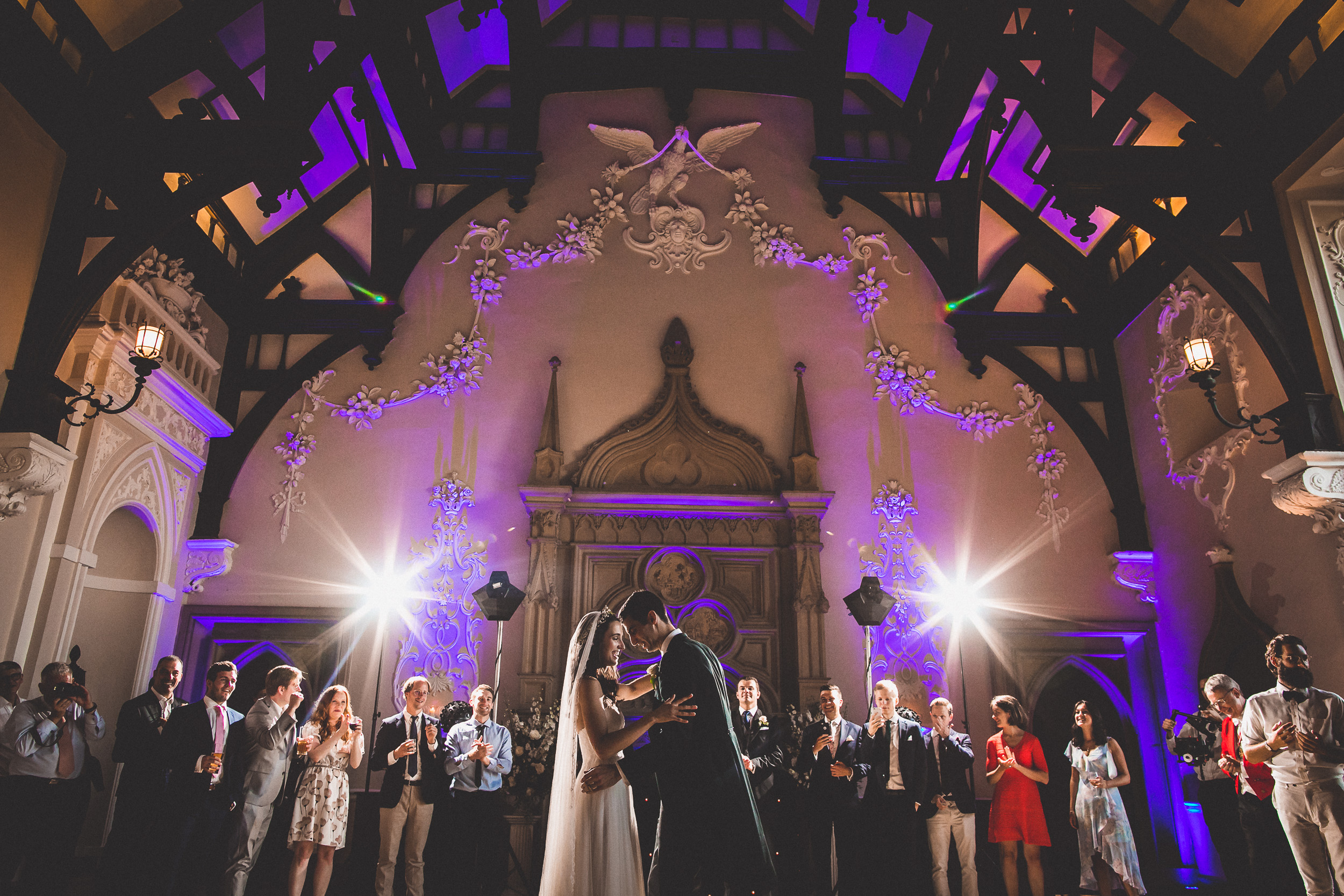 A bride and groom share their first dance at the wedding, beautifully captured by the photographer.