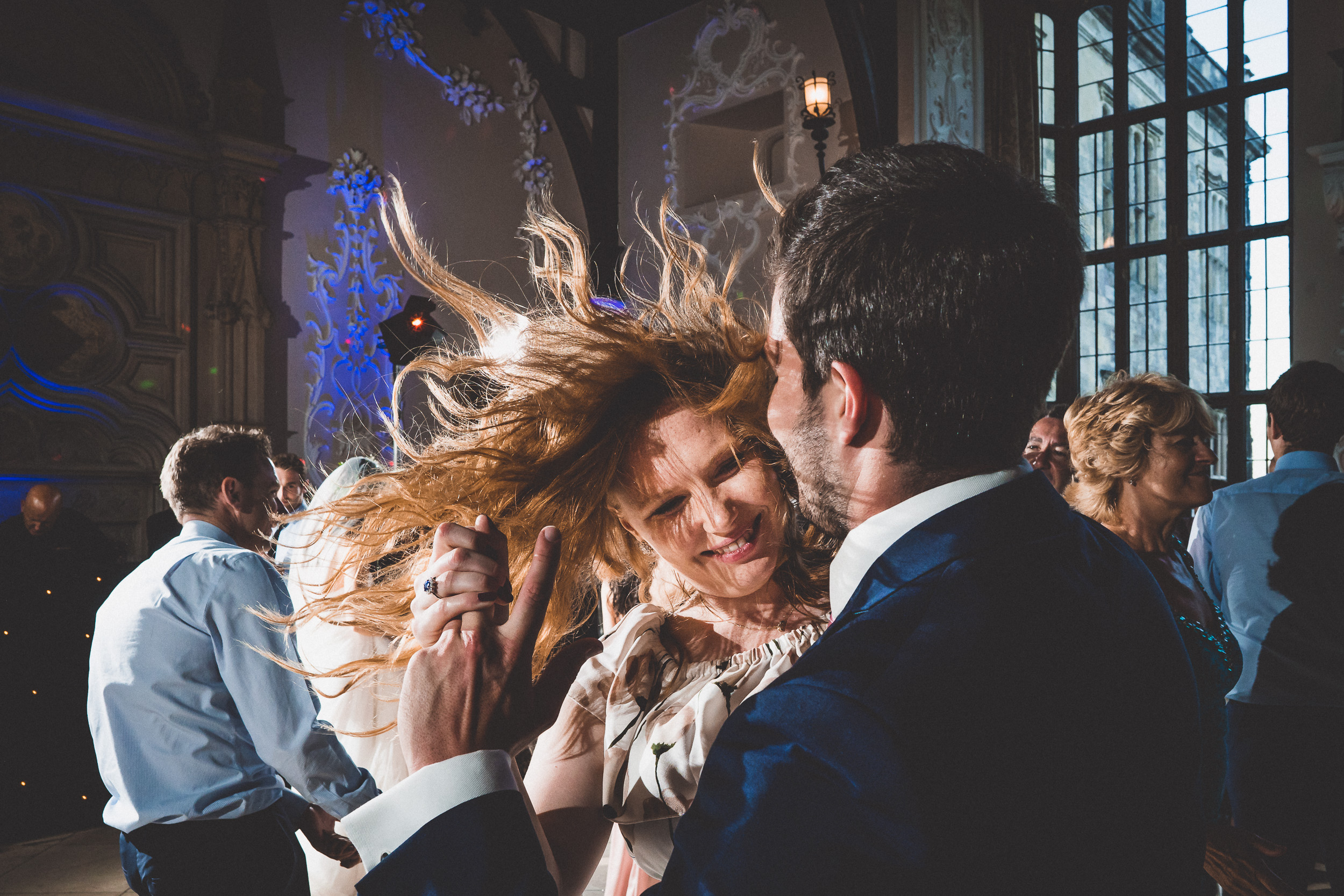 A bride and groom dancing at their wedding reception.