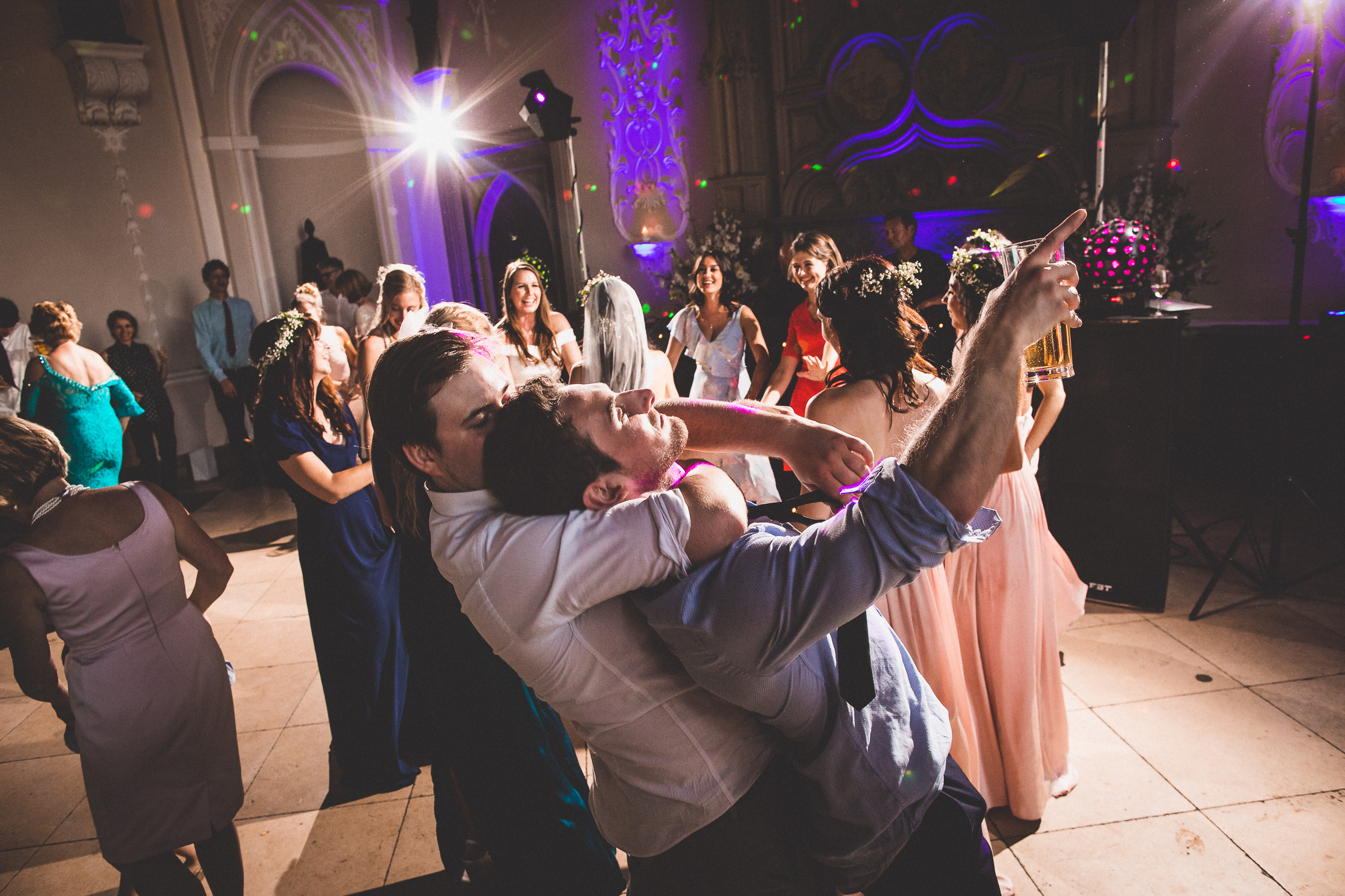 A groom and his partner gracefully dancing on the wedding dance floor.