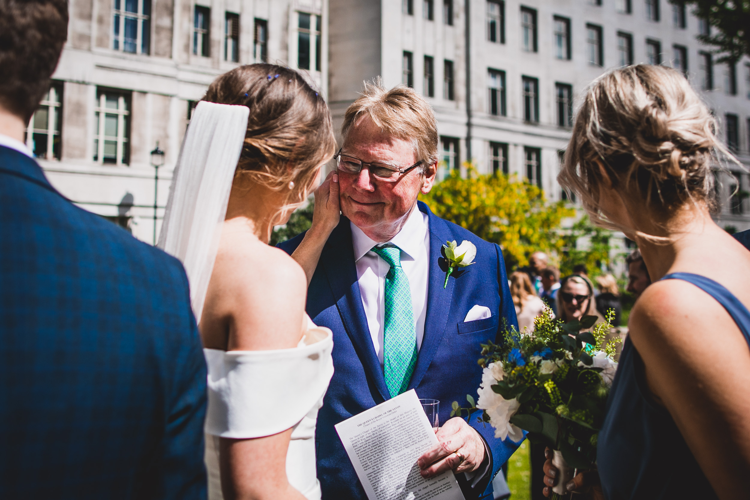 A wedding photo capturing the intimate gaze between the bride and groom during their ceremony.