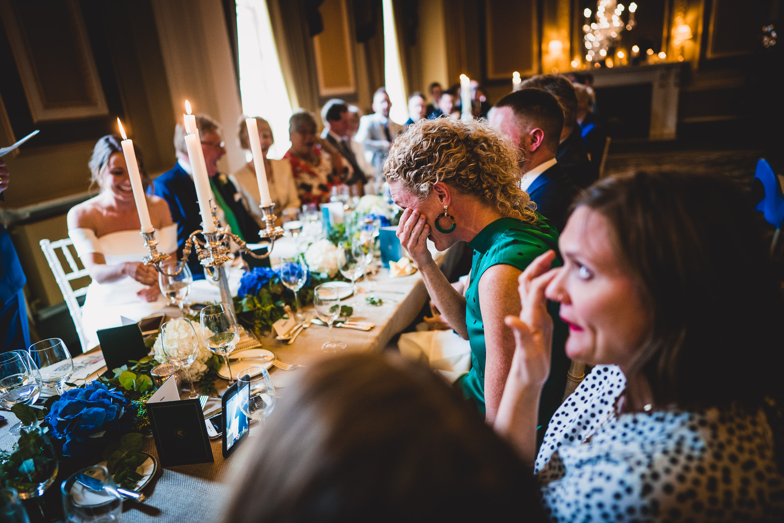 A group of people celebrating the wedding at a table.