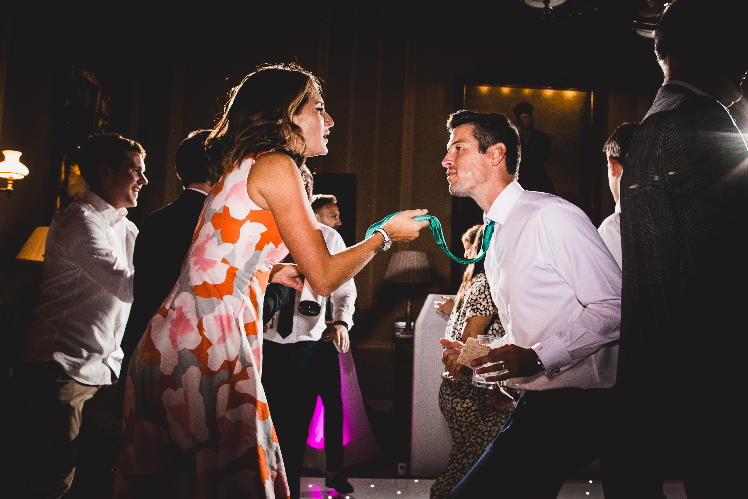 A groom and bride dancing at their wedding reception.