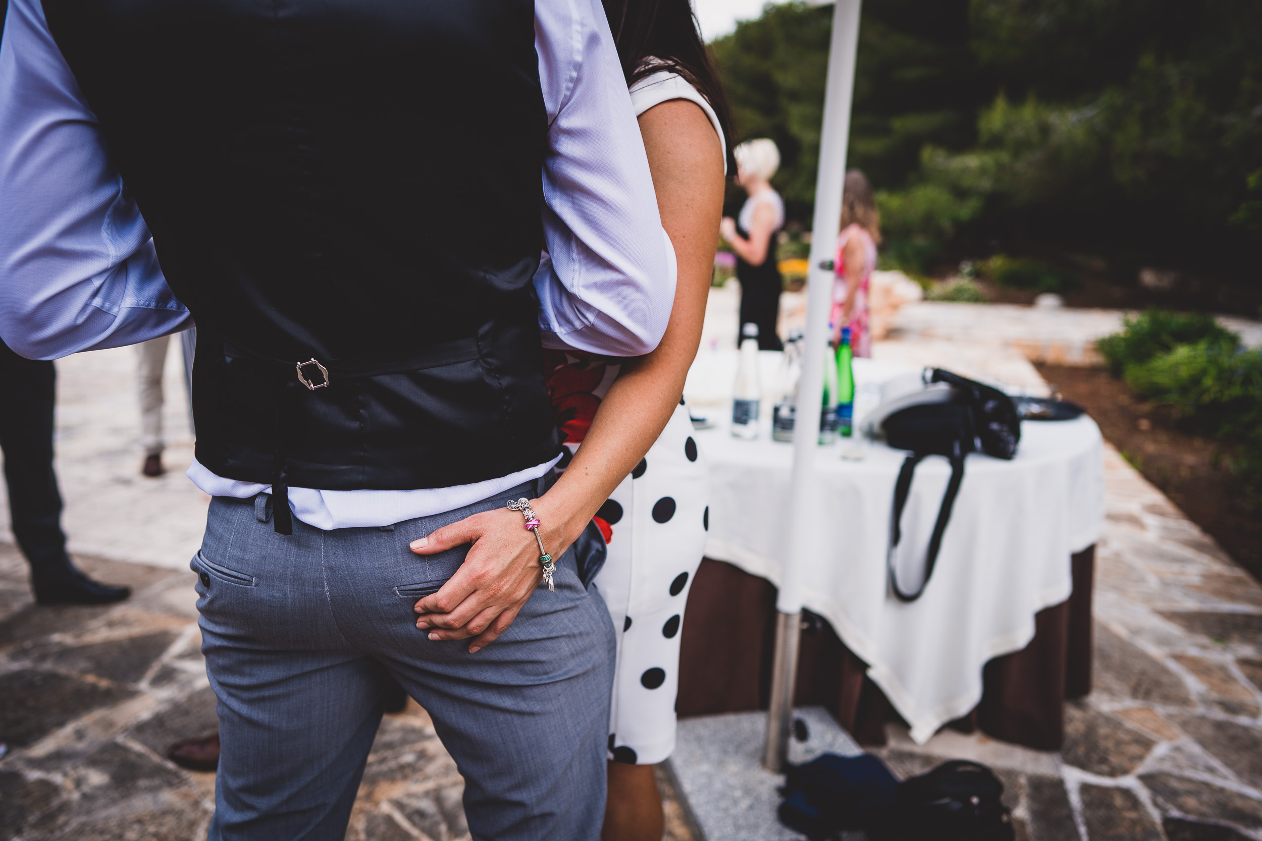 A wedding photographer captures an intimate wedding photo of a bride and groom embracing each other.