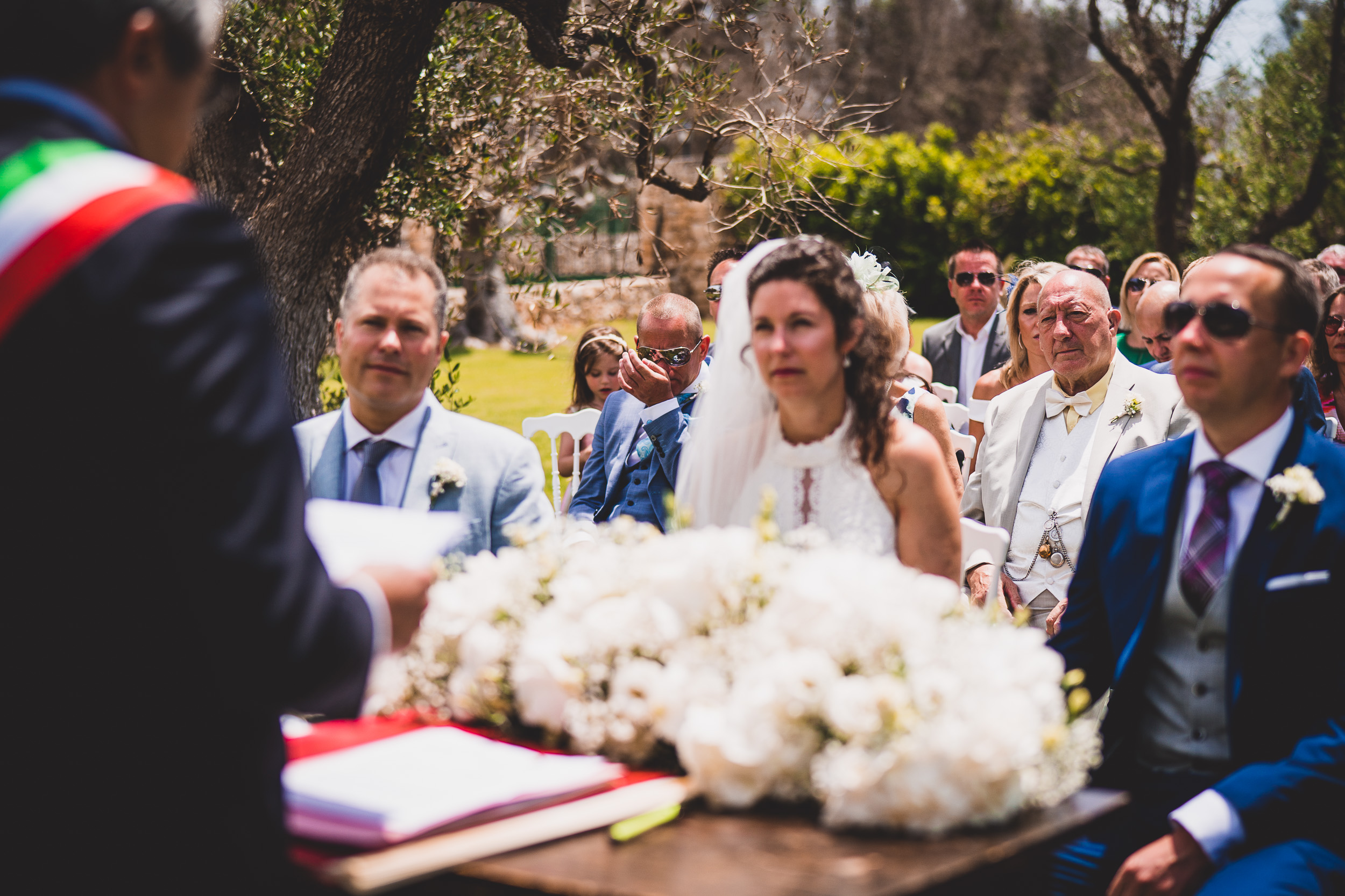 An outdoor wedding ceremony featuring a bride and groom captured in a beautiful wedding photo.