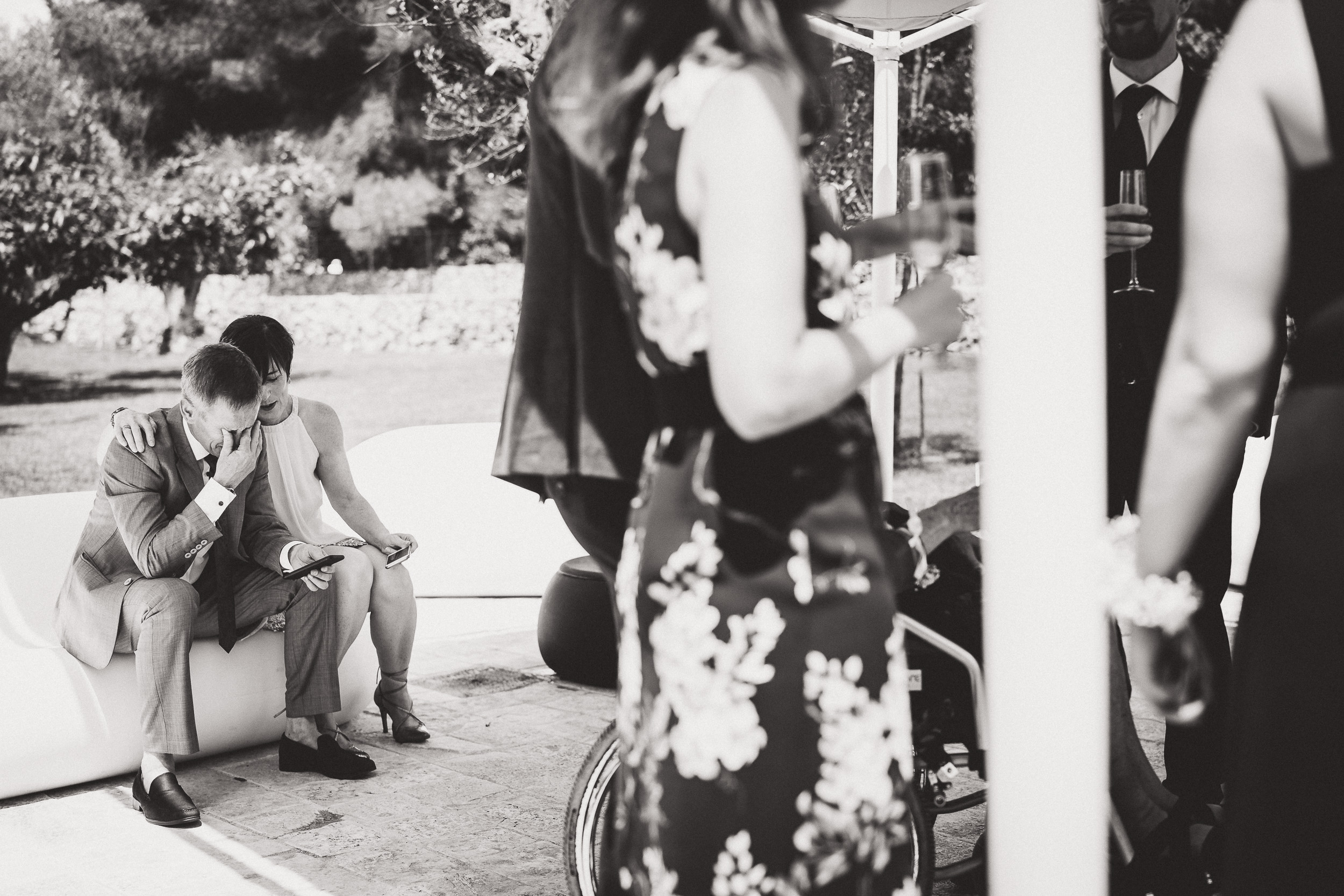 A black and white wedding photo capturing a group of people.