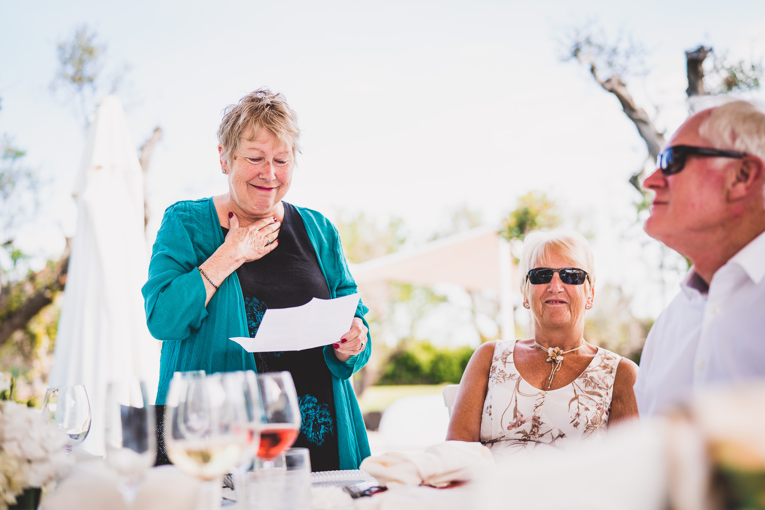 A bride wearing a blue shirt in a wedding photo.