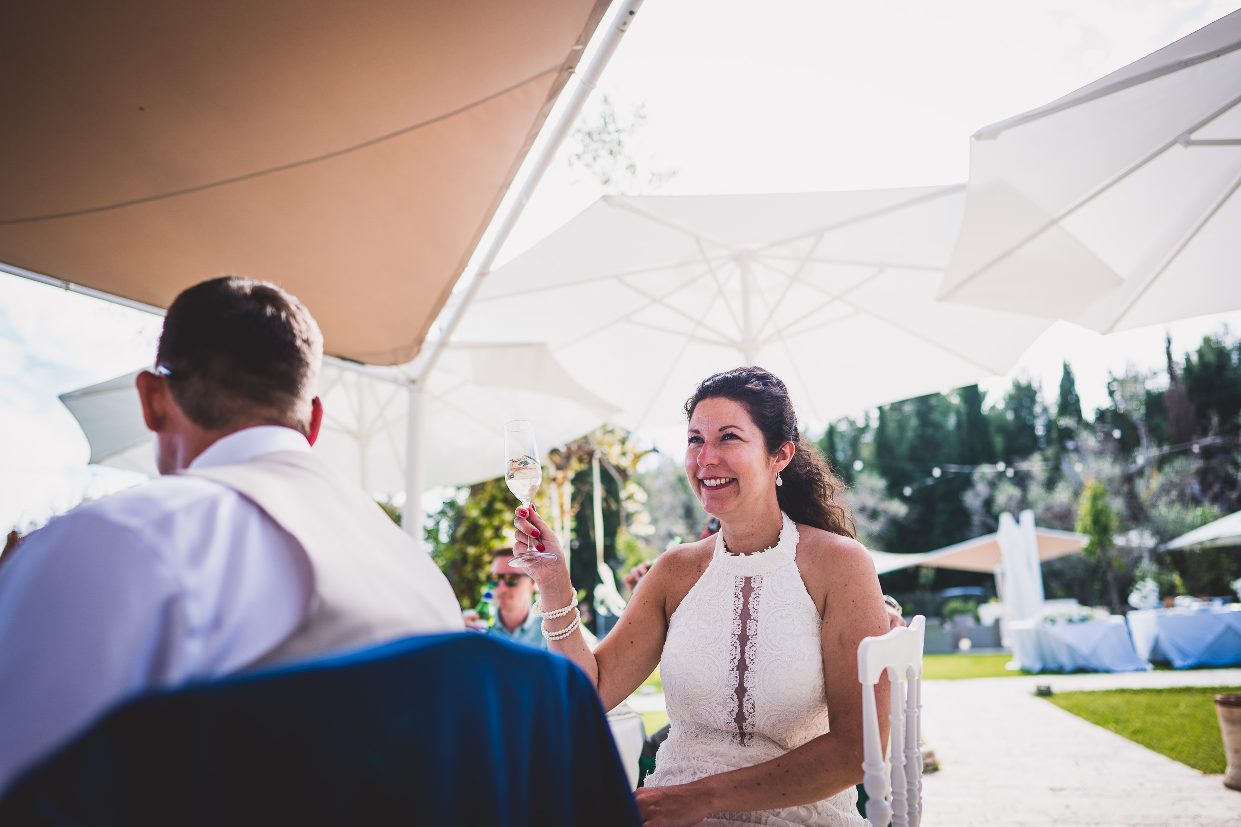 A wedding couple posing at a table, captured by a wedding photographer.