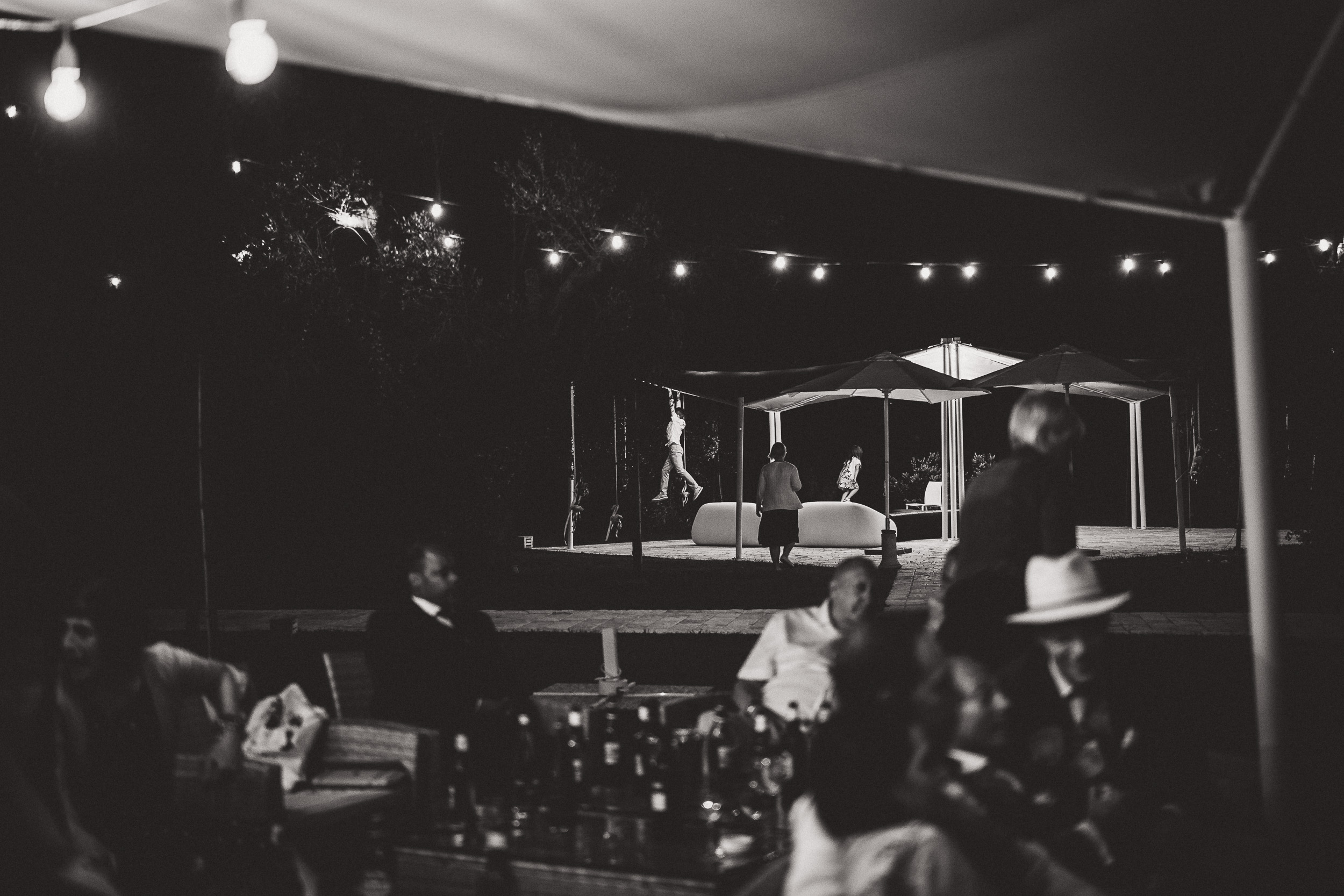 A black and white wedding reception photo at night.