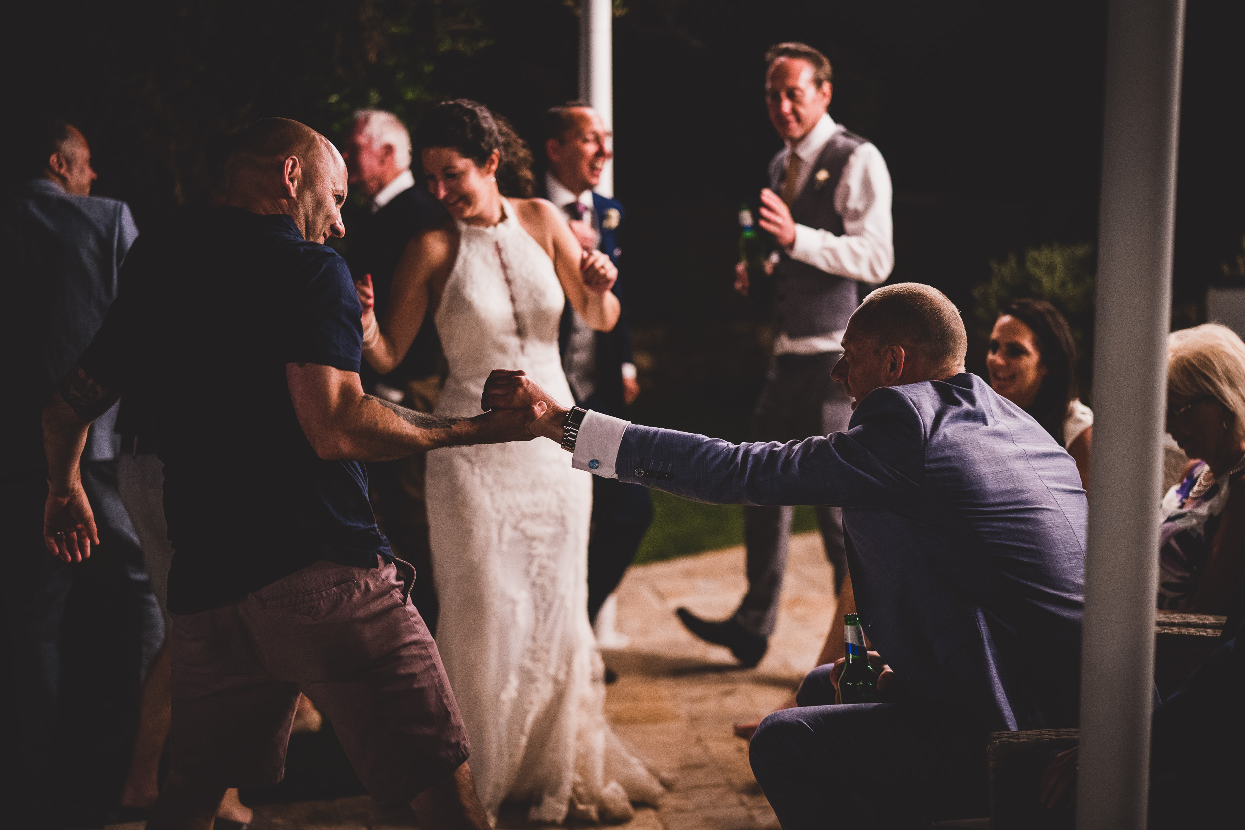 A wedding photo capturing the bride and groom dancing at their reception.