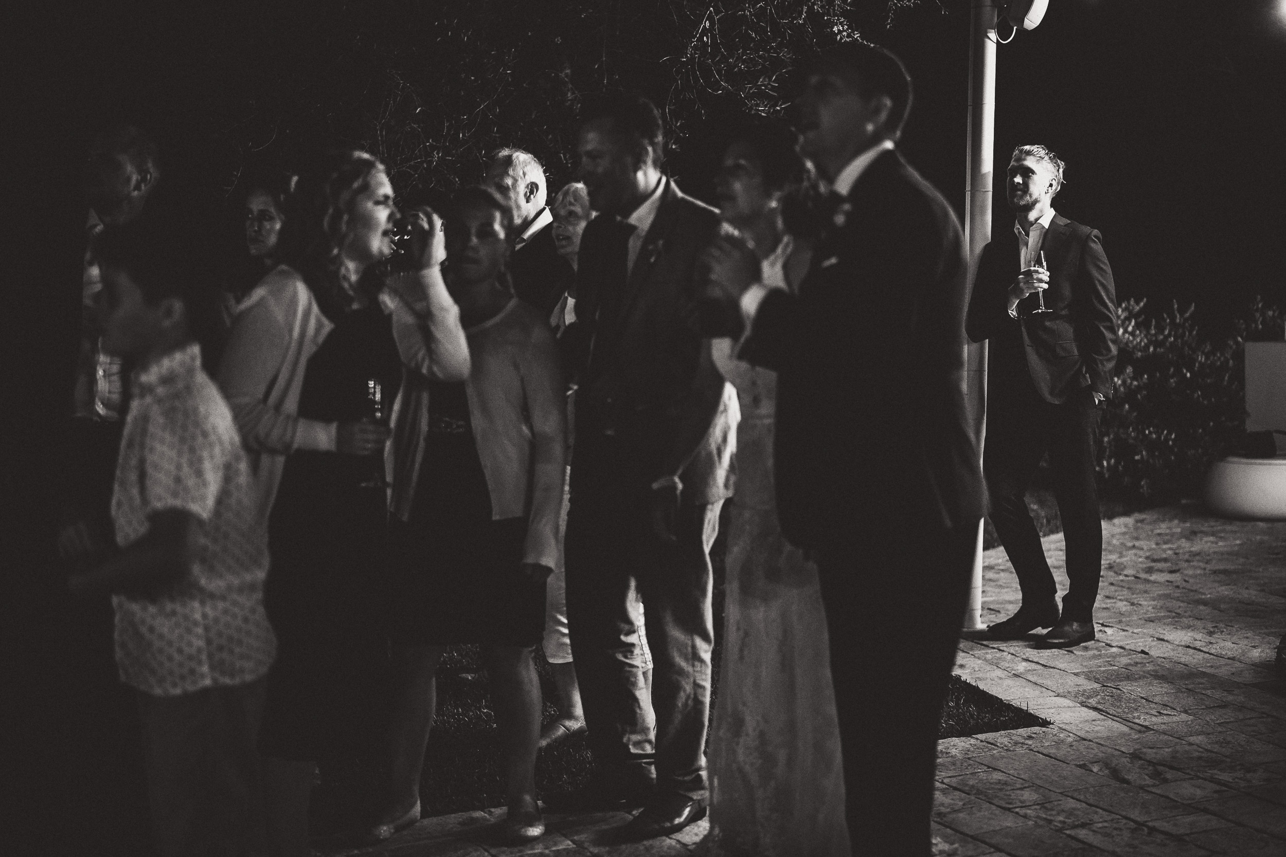 A group photographed at a wedding.