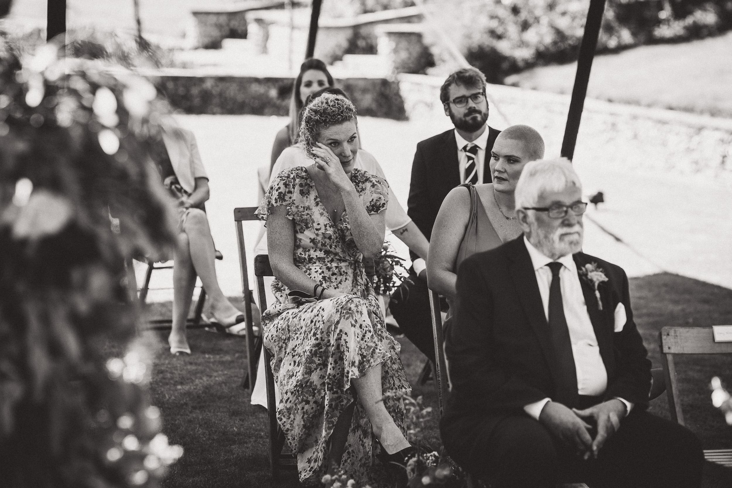 A black and white photo of a wedding ceremony captured by a wedding photographer.