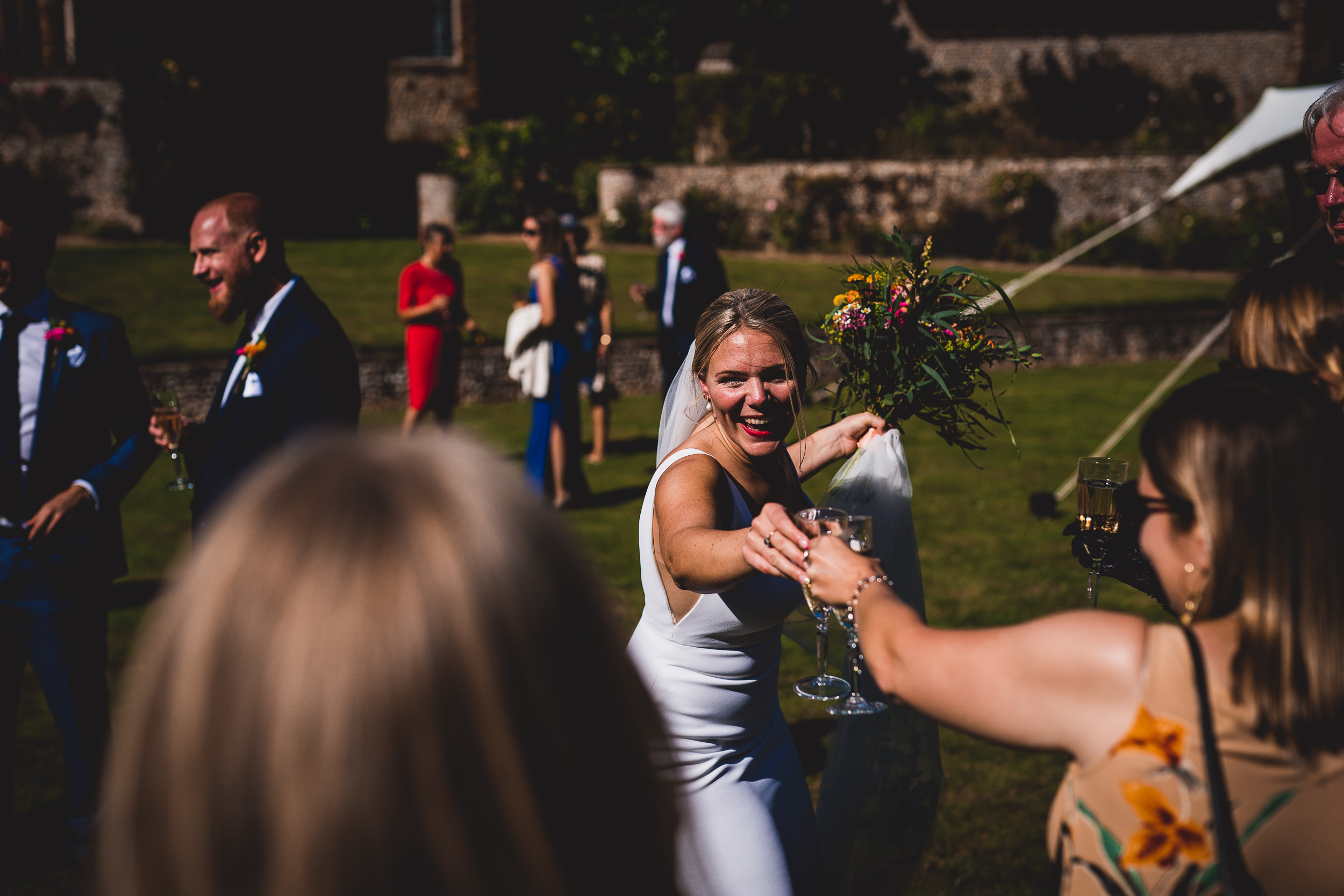 A newlywed couple joyfully celebrating their wedding at a picturesque country house.