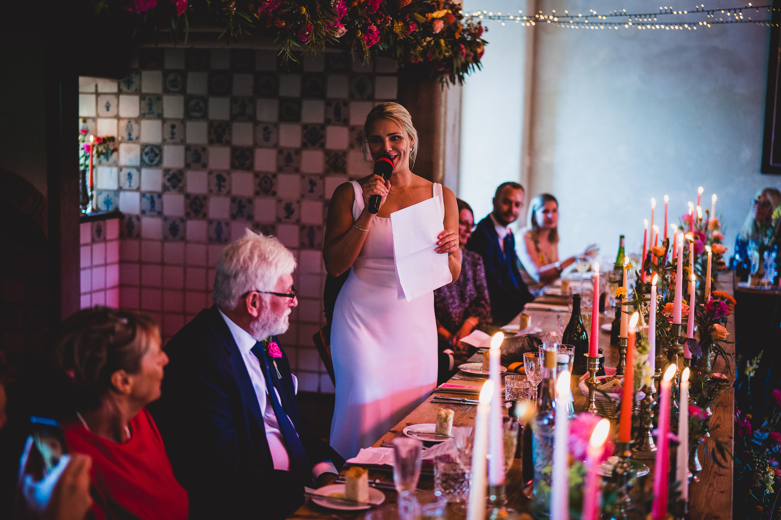 A bride delivering a speech at her wedding.