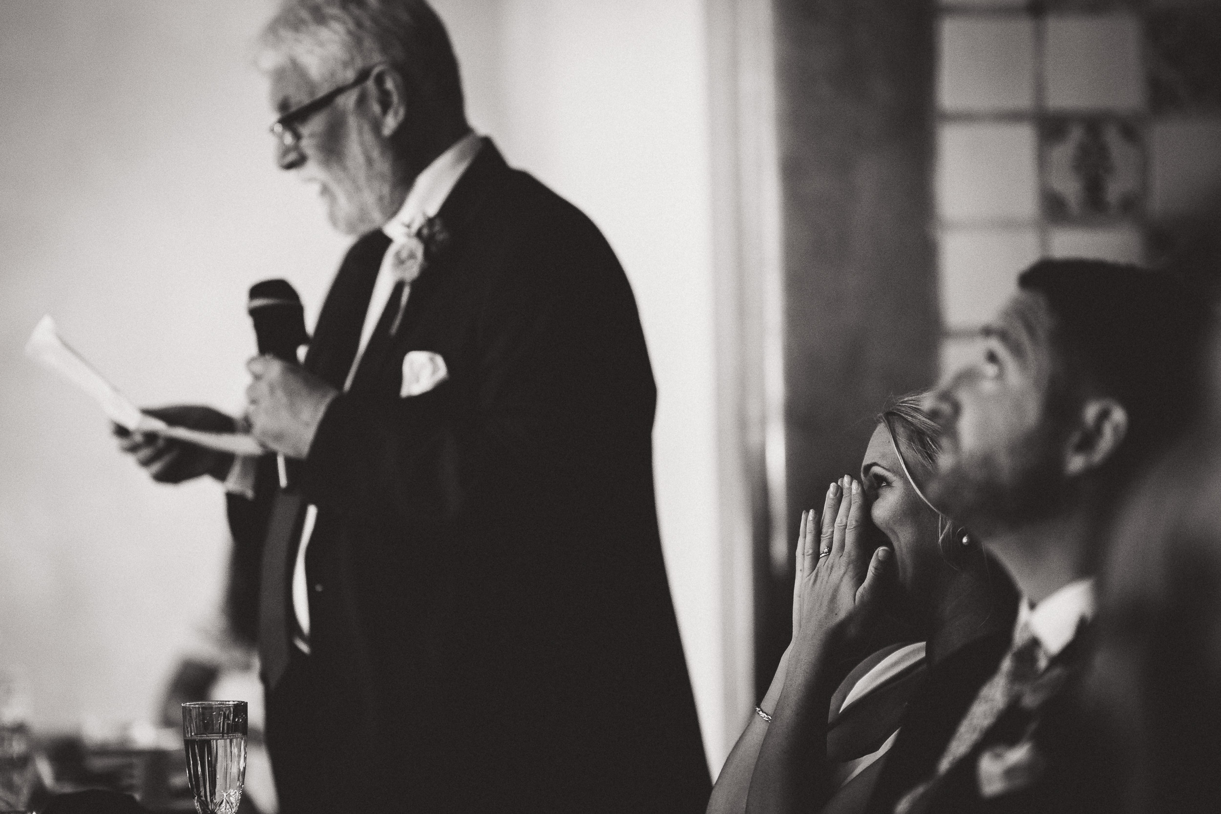 Groom giving speech at wedding.