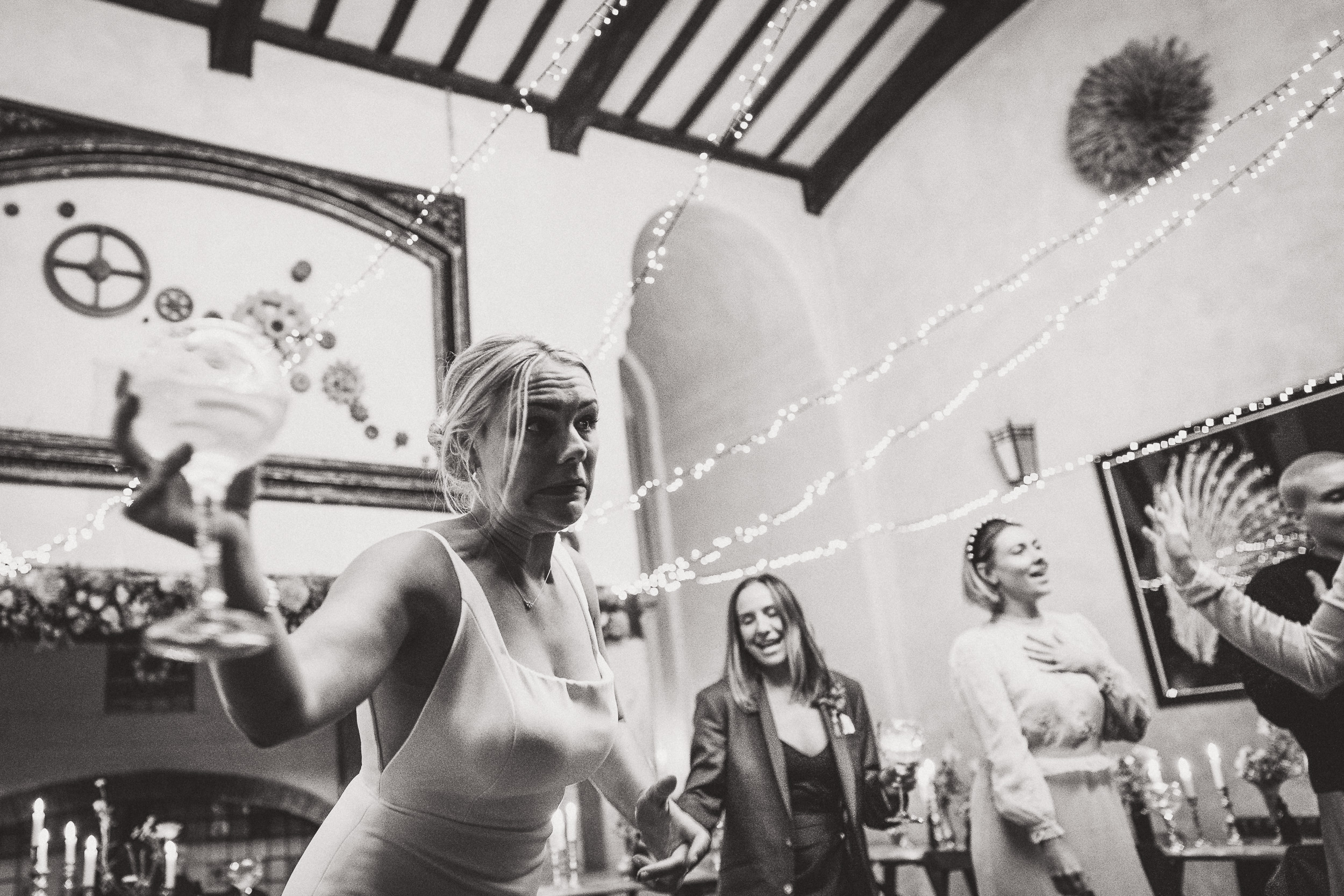 A bride and groom dancing at a wedding reception, captured by a wedding photographer.