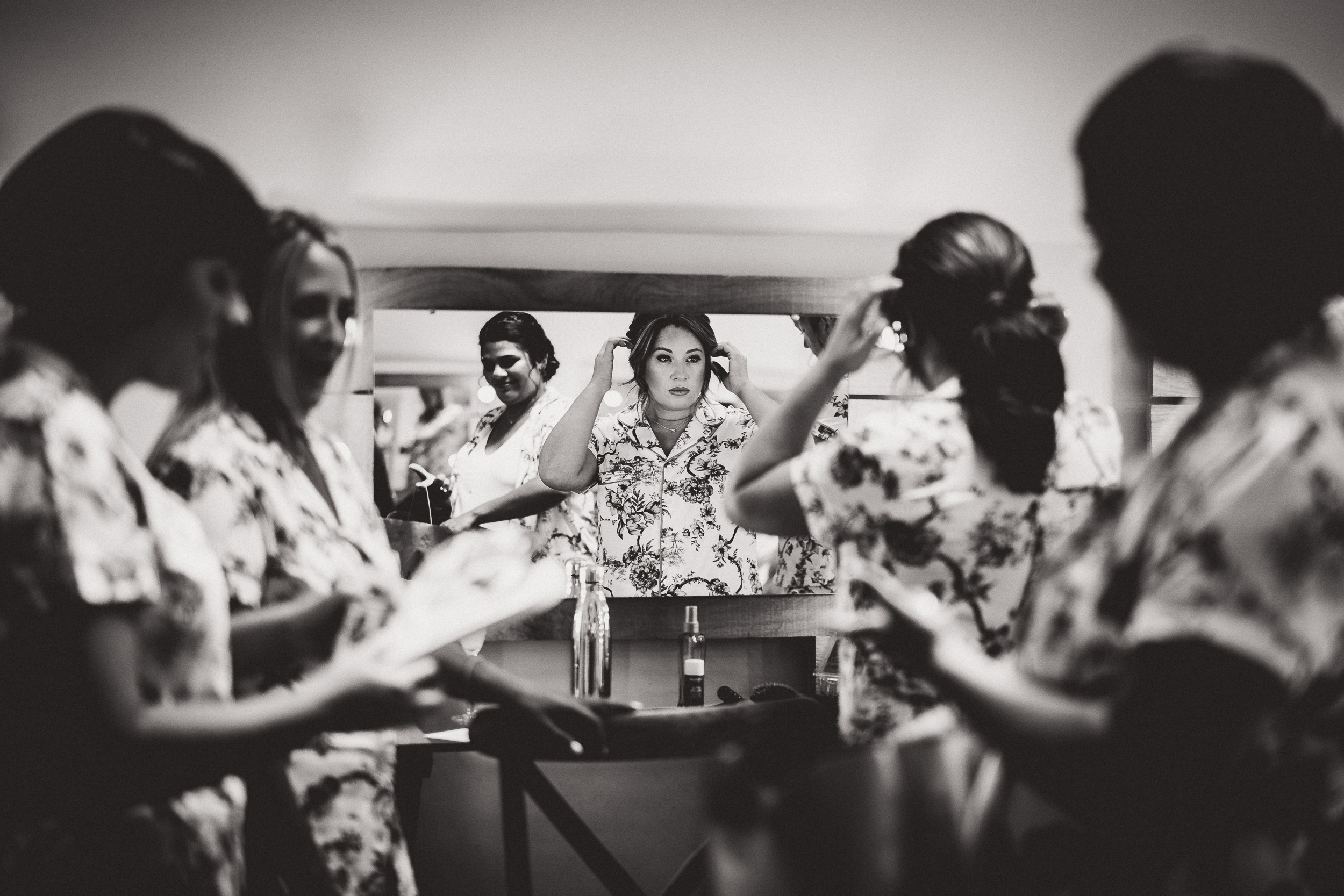 A bride preparing for her wedding day, capturing the moment with a wedding photographer.